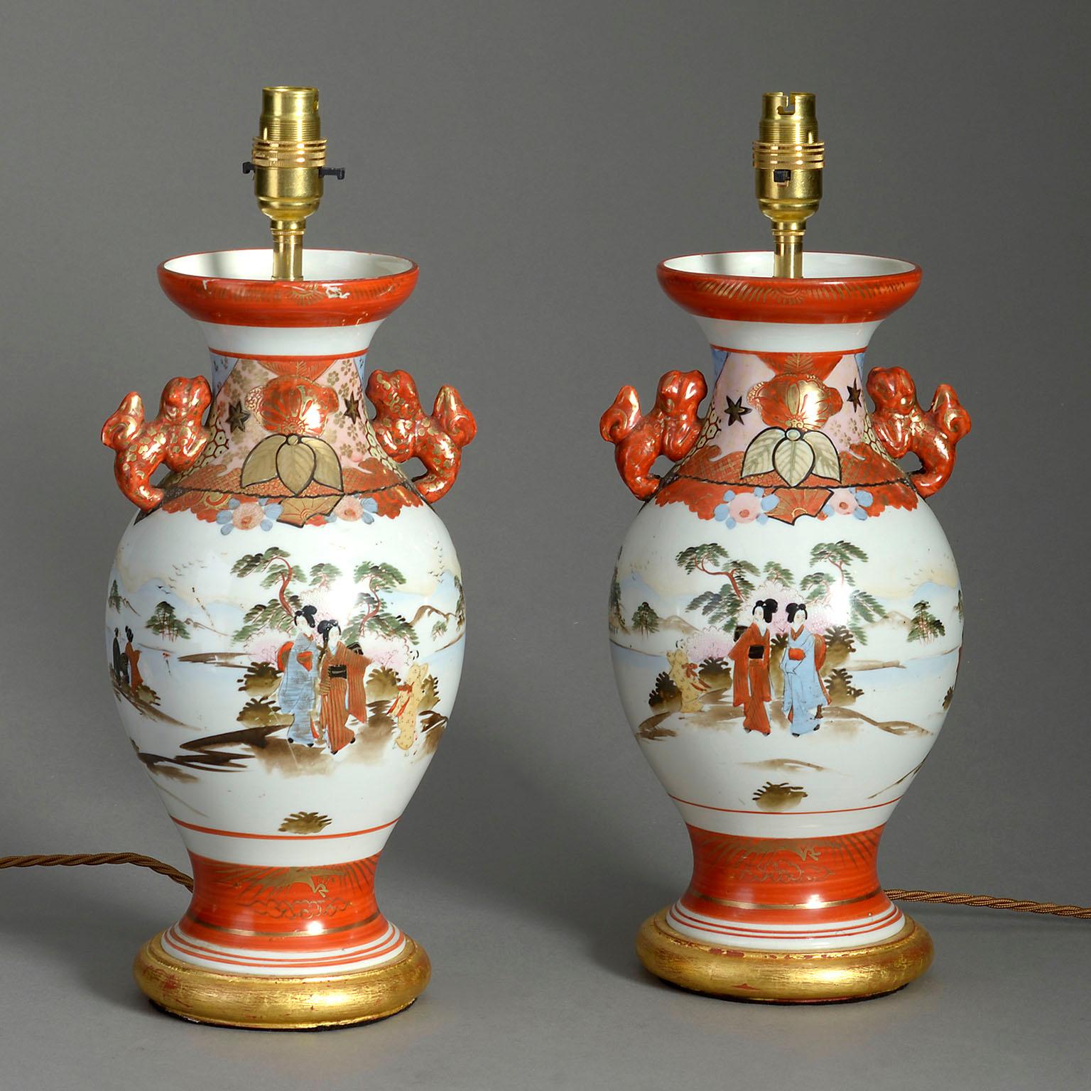 A pair of late 19th century orange glazed satsuma vases, each with handles and a bulbous body, decorated with courtly figures in landscapes. Now raised on turned giltwood bases as table lamps.

Meiji Period

Dimensions refer to vases and bases