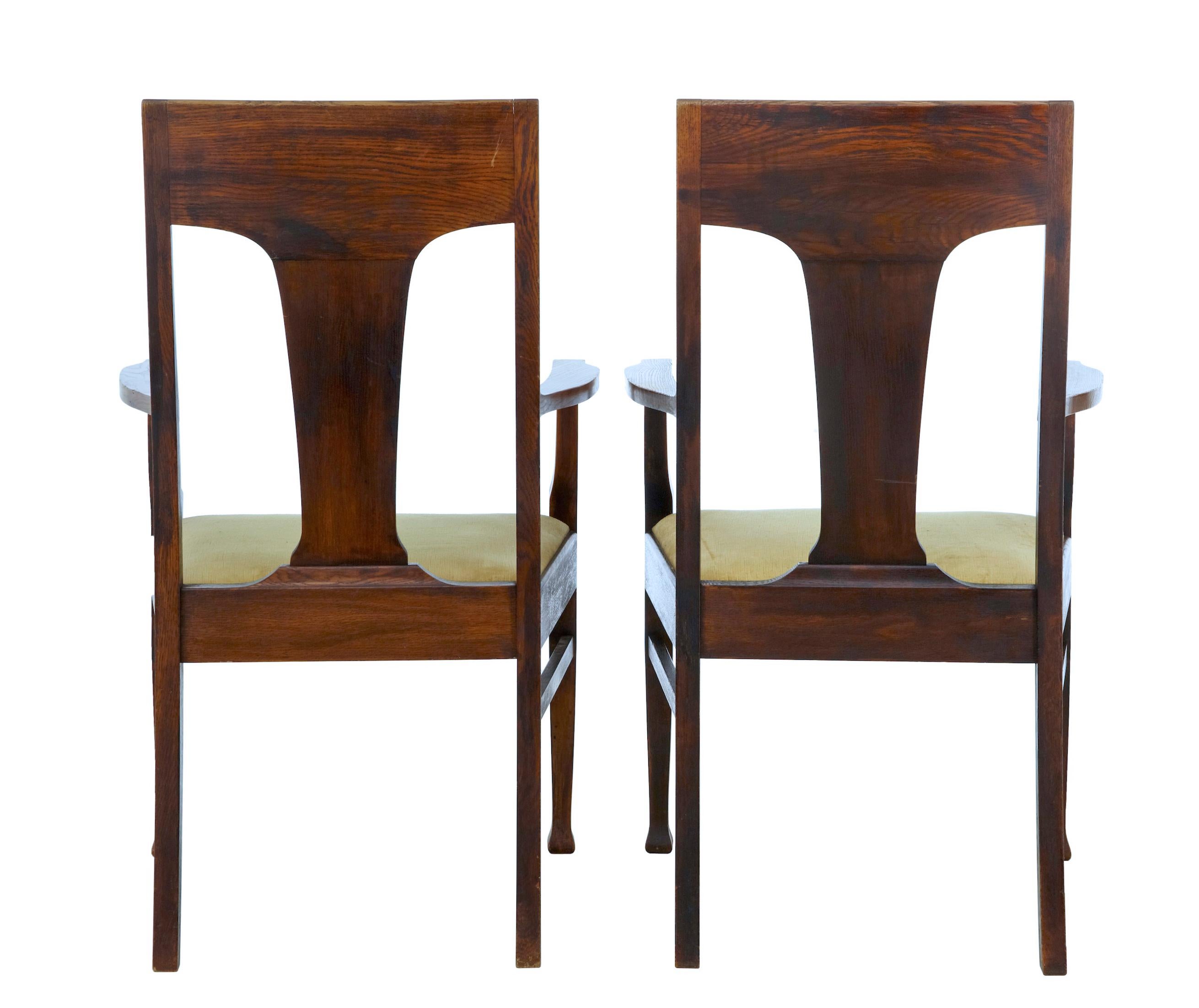 Pair of late 19th century oak Arts & Crafts armchairs, circa 1890.

Fine example of the arts and crafts movement. Made from solid oak with shaped backs featuring a carved leaf and berry design in the back rest. Shaped arms, supported by tapering