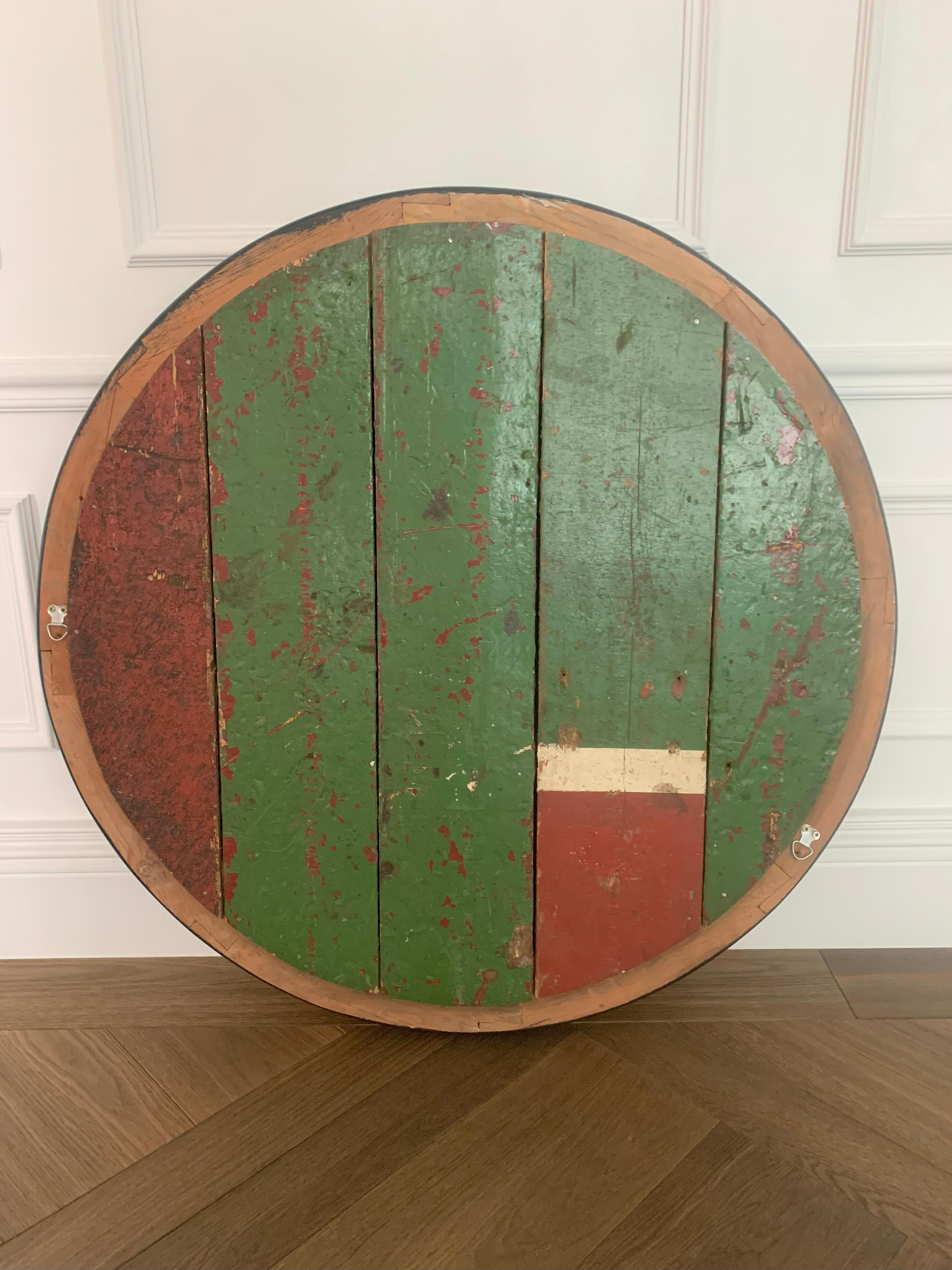 This striking pair of Regency Revival convex mirrors, likely dating to the late 19th century, offers a refined interpretation of the traditional Regency convex mirror aesthetic. More restrained than their early 19th-century counterparts, each