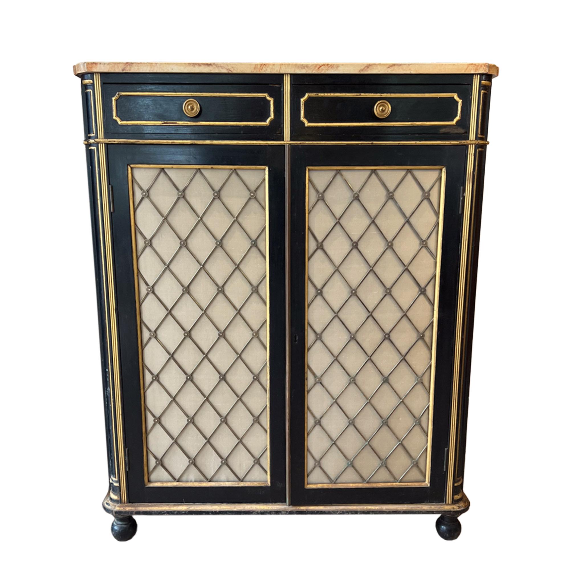 A really good pair of ebonised Regency style cabinets, made in the United Kingdom in the late 19th century. 

The cabinets are tall featuring a two-door design, with two drawers above. Both stand on four rounded bun feet - a traditional addition for