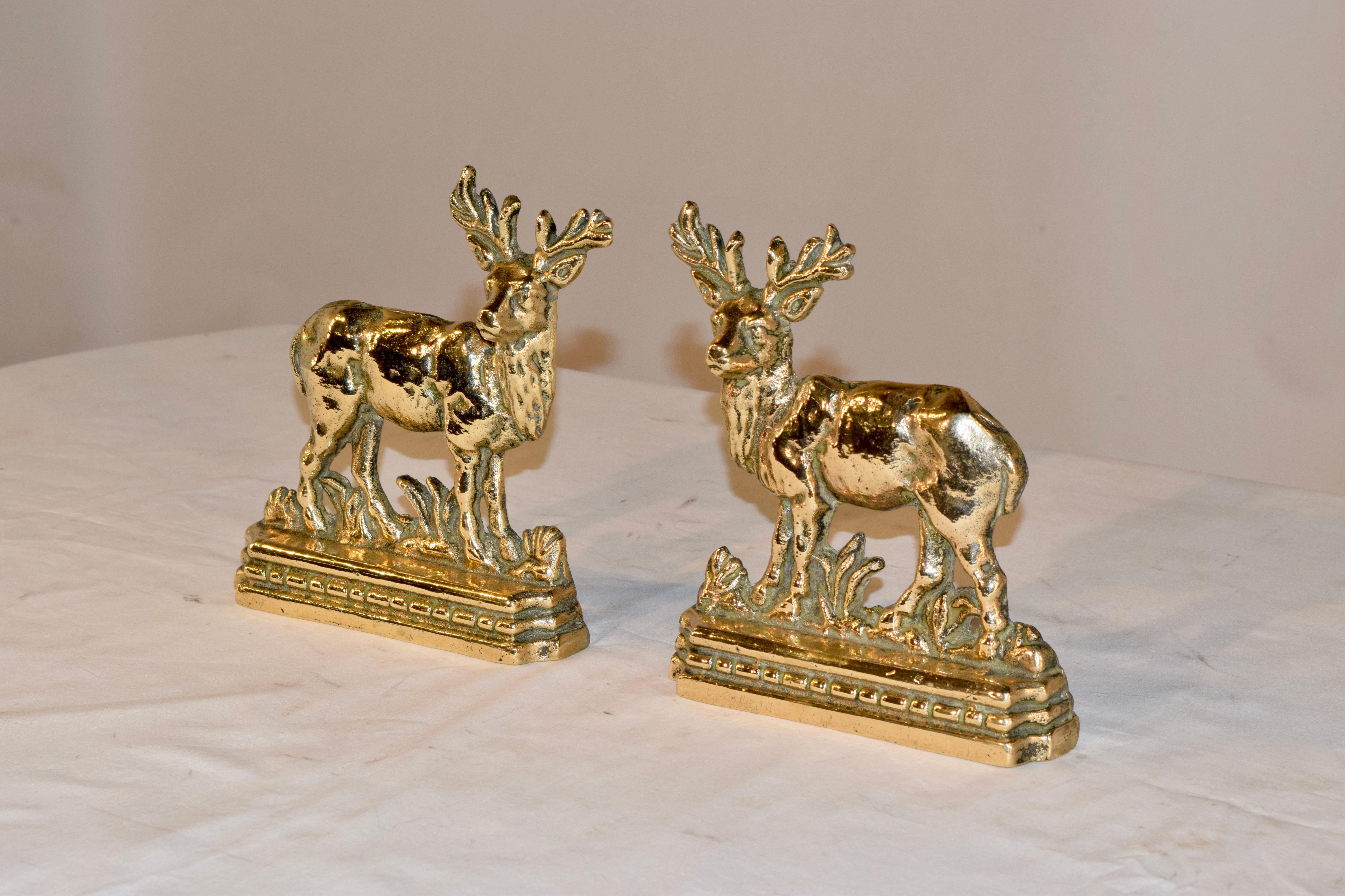 Pair of late 19th century English cast brass mantle decorations in the form of stags. They are beautifully cast with lovely detail and design.