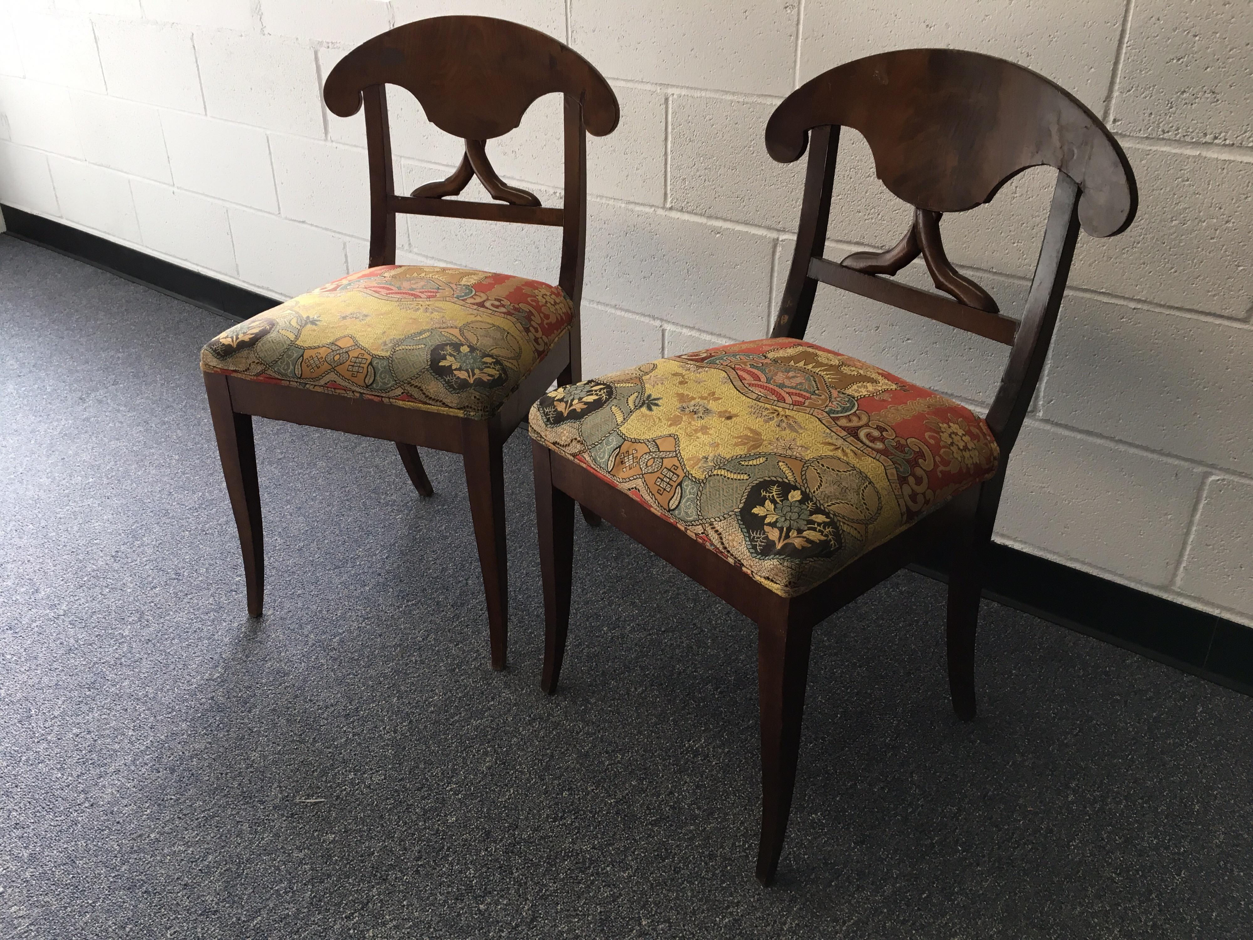 Pair of late 19th century Swedish Biedermeier side chairs with silk fabric. Beautiful silk fabric in great condition. Visible repairs to the seat back. Structurally sound. Some scratches to the finish.
