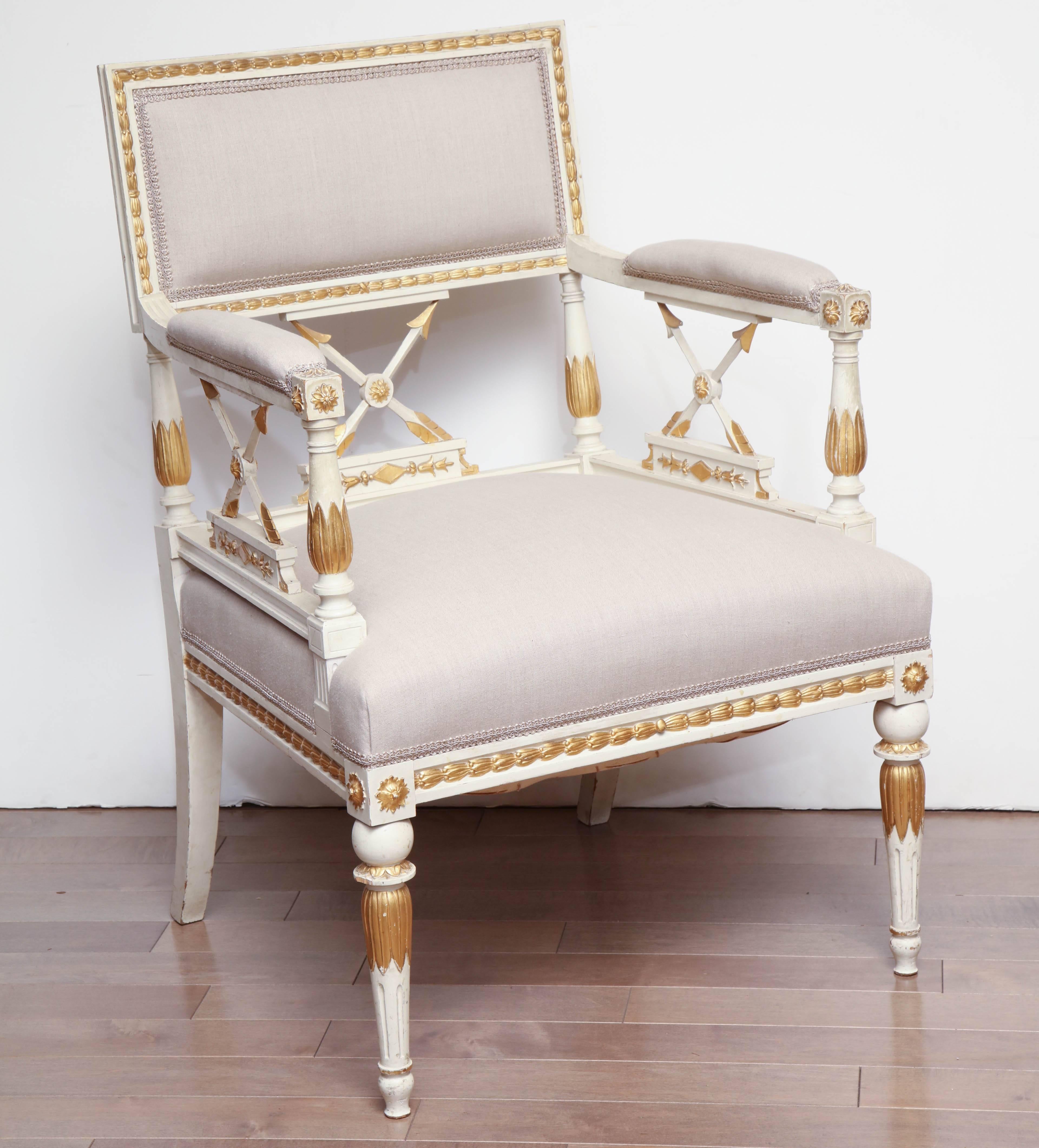 Pair of late 19th century Gustavian, painted and parcel-gilt 
armchairs.