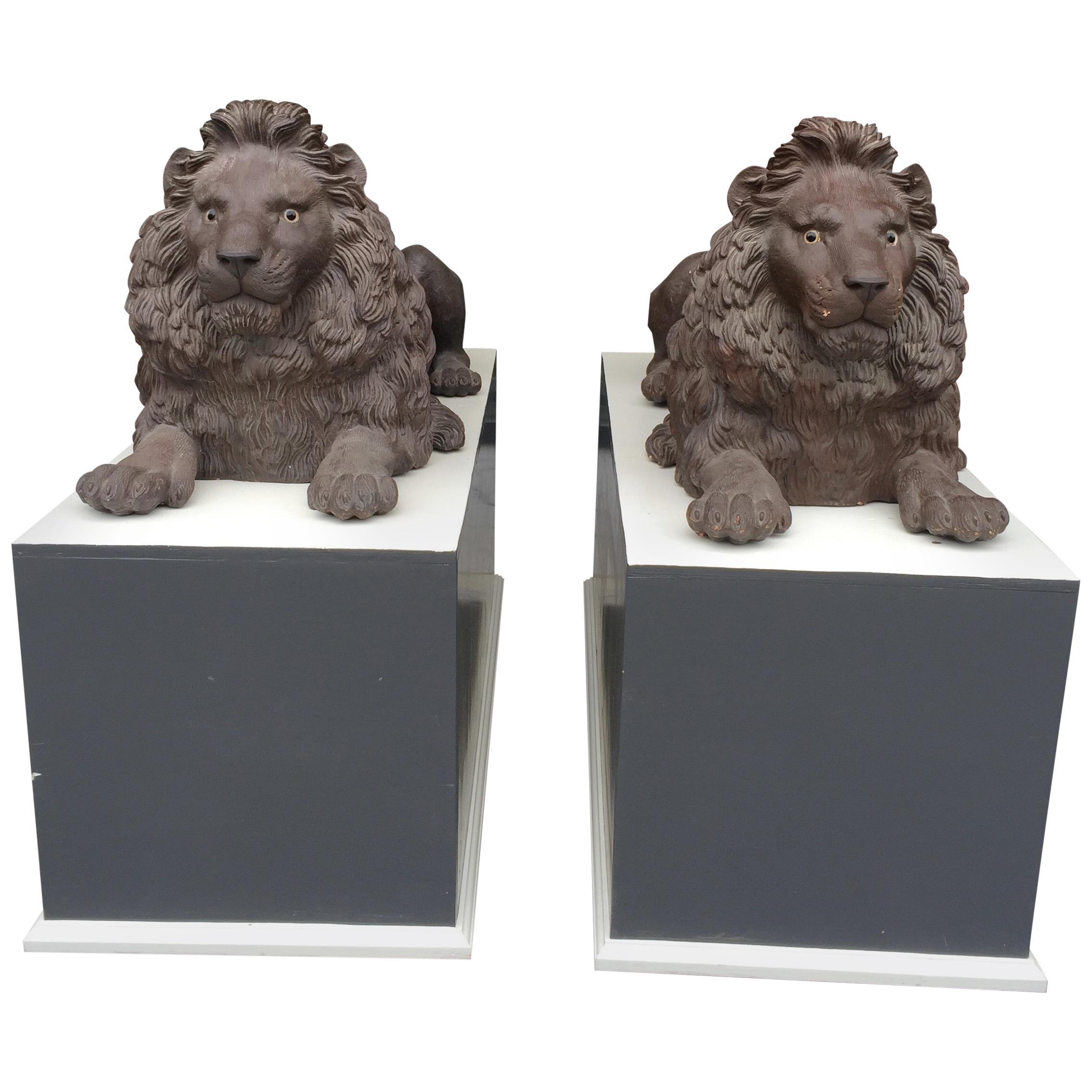 Pair of Late 19th Century Terracotta Lions in Resting Pose For Sale