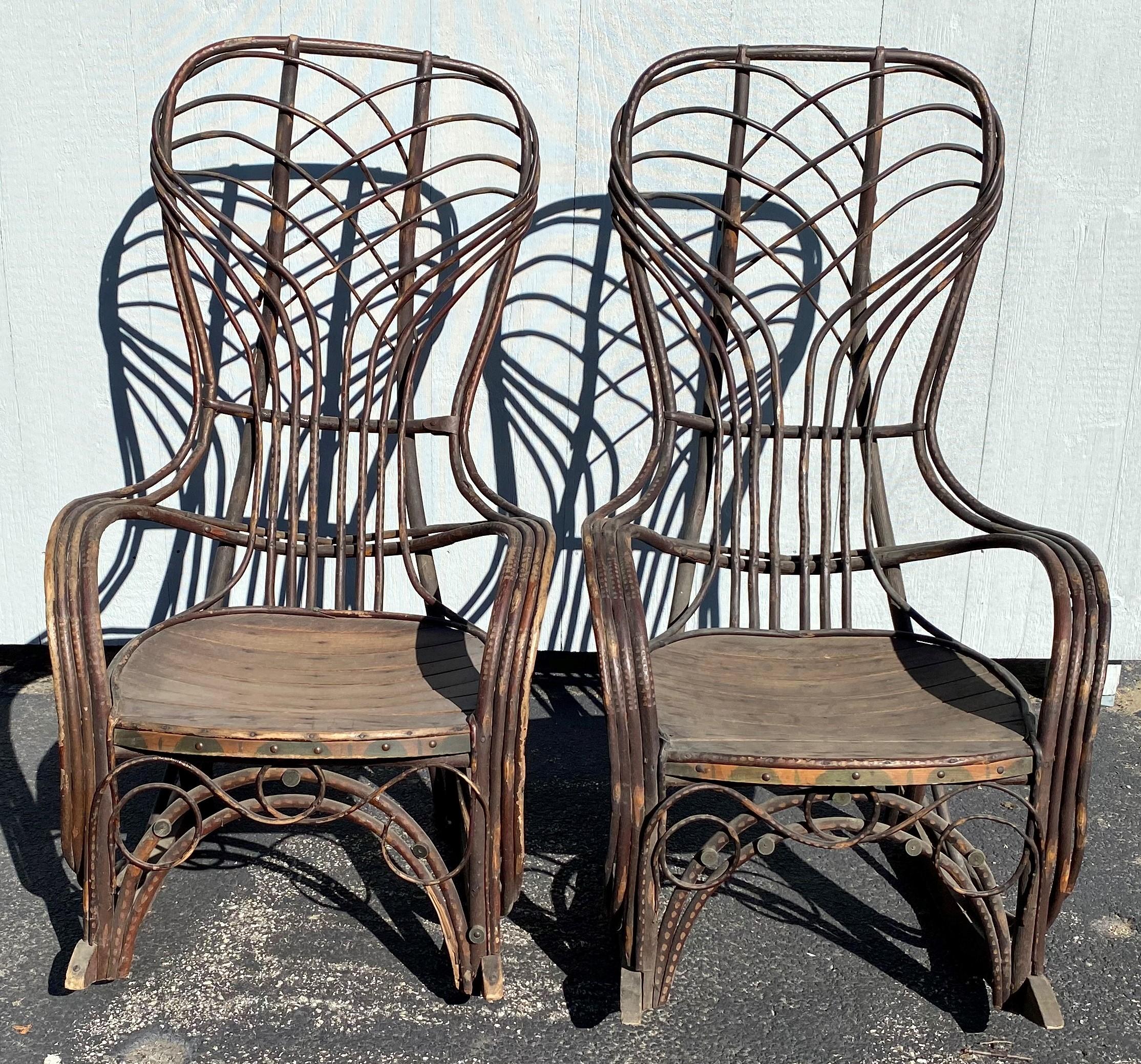 A fine pair of twig bentwood Adirondack rocking chairs with painted highlights and great overall patina, probably dating to the late 19th century in very good overall condition, with a few shrinkage splits, paint fade and losses, and other