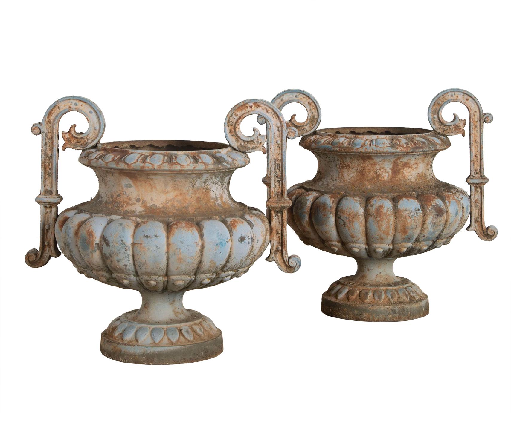 Decorative pair of late 19th century garden urns with superb pale blue patina.