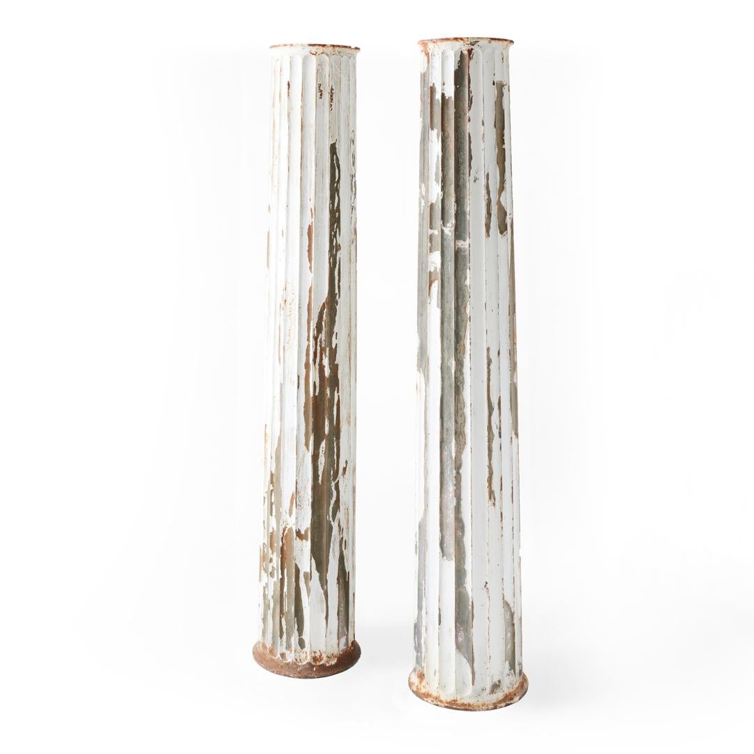 - Dimensions: 11” top diameter x 13.5” bottom diameter x 72.5” high

- Classicism at its most chic. We love this pair of fluted and beautifully aged columns, made entirely from zinc. 

- This slender pair makes a graceful statement wherever they're