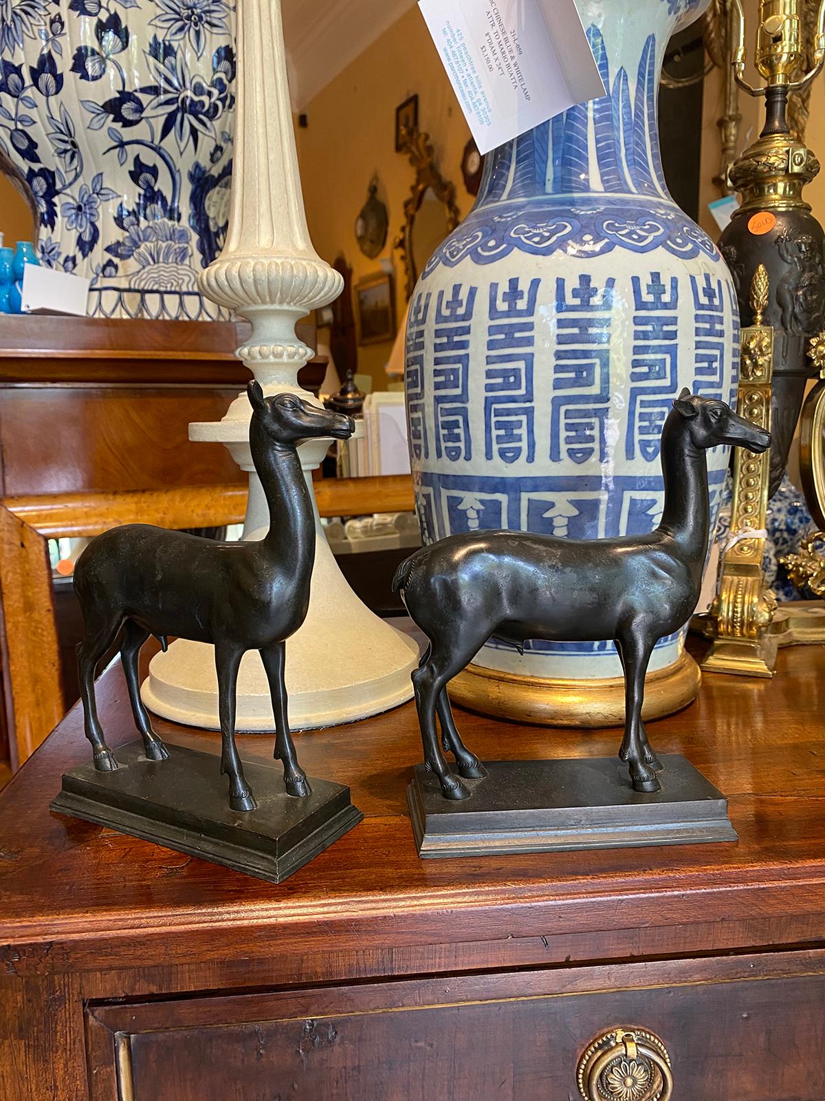 Pair of late 19th-early 20th century continental bronze deer after the ancient Pompeian model. Base measures 6