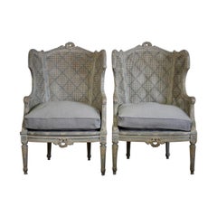 Pair of Late 19th-Early 20th Century French Painted Caned Bergeres