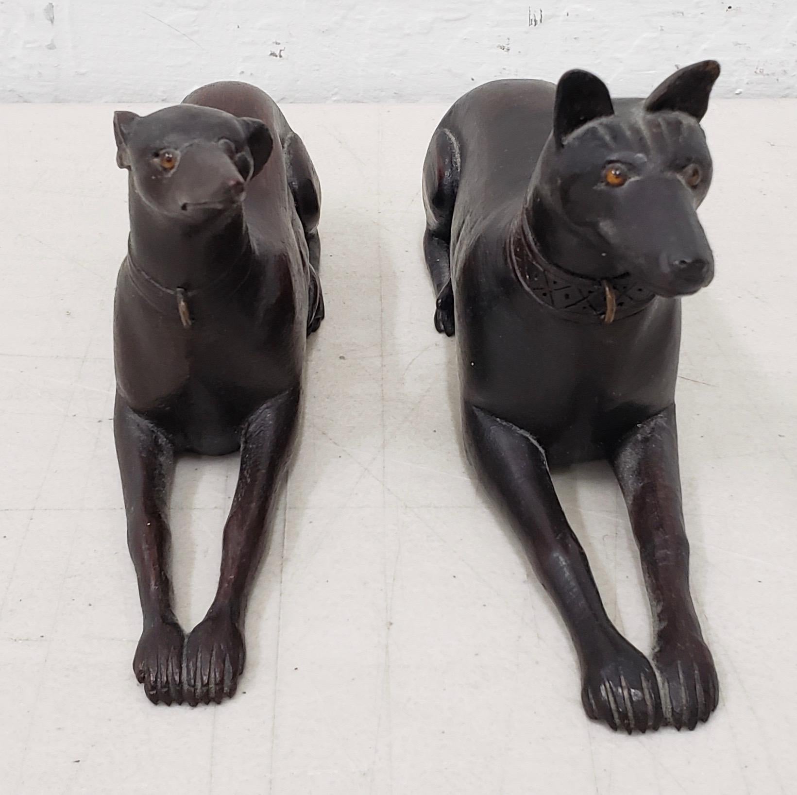 Pair of late 19th-early 20th century hand carved wooden greyhounds

Terrific matching pair of hand carved wooden Greyhound dogs. One male, one female.

Each dog is beautifully carved by a talented hand and they have their original glass