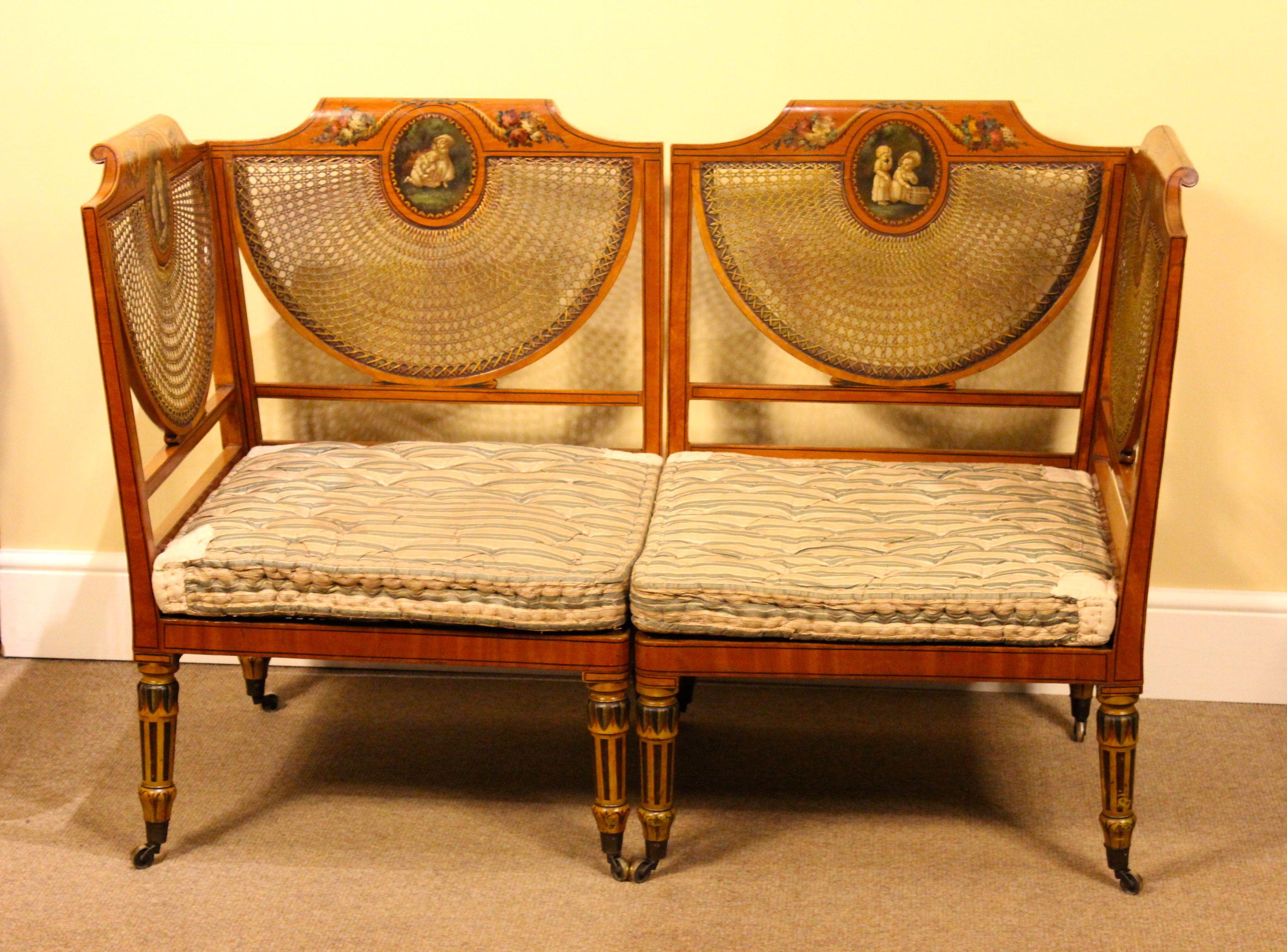 5796
Pair of late 19thc. Satinwood Corner Seats
That unite to form a sofa. Originally made
For Palace Court, Bayswater with painted scenes
On each panel with floral decoration & painted
Legs.
Measures: 52.5”W x 36” H x 26” D
133cm W x 92cm H