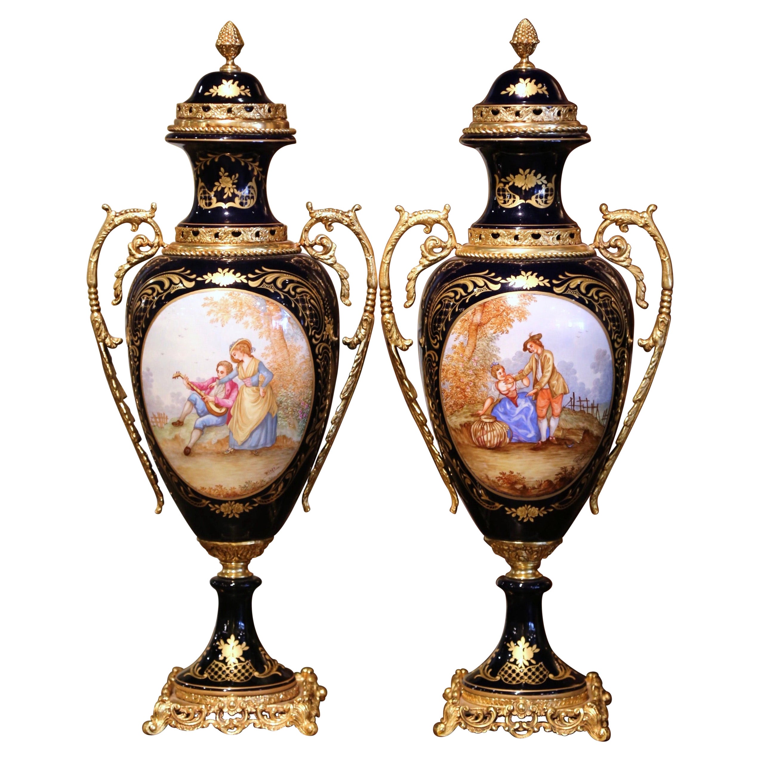 Pair of Late 20th Century French Blue Royal Porcelain 
Brass Sèvres Style Urns