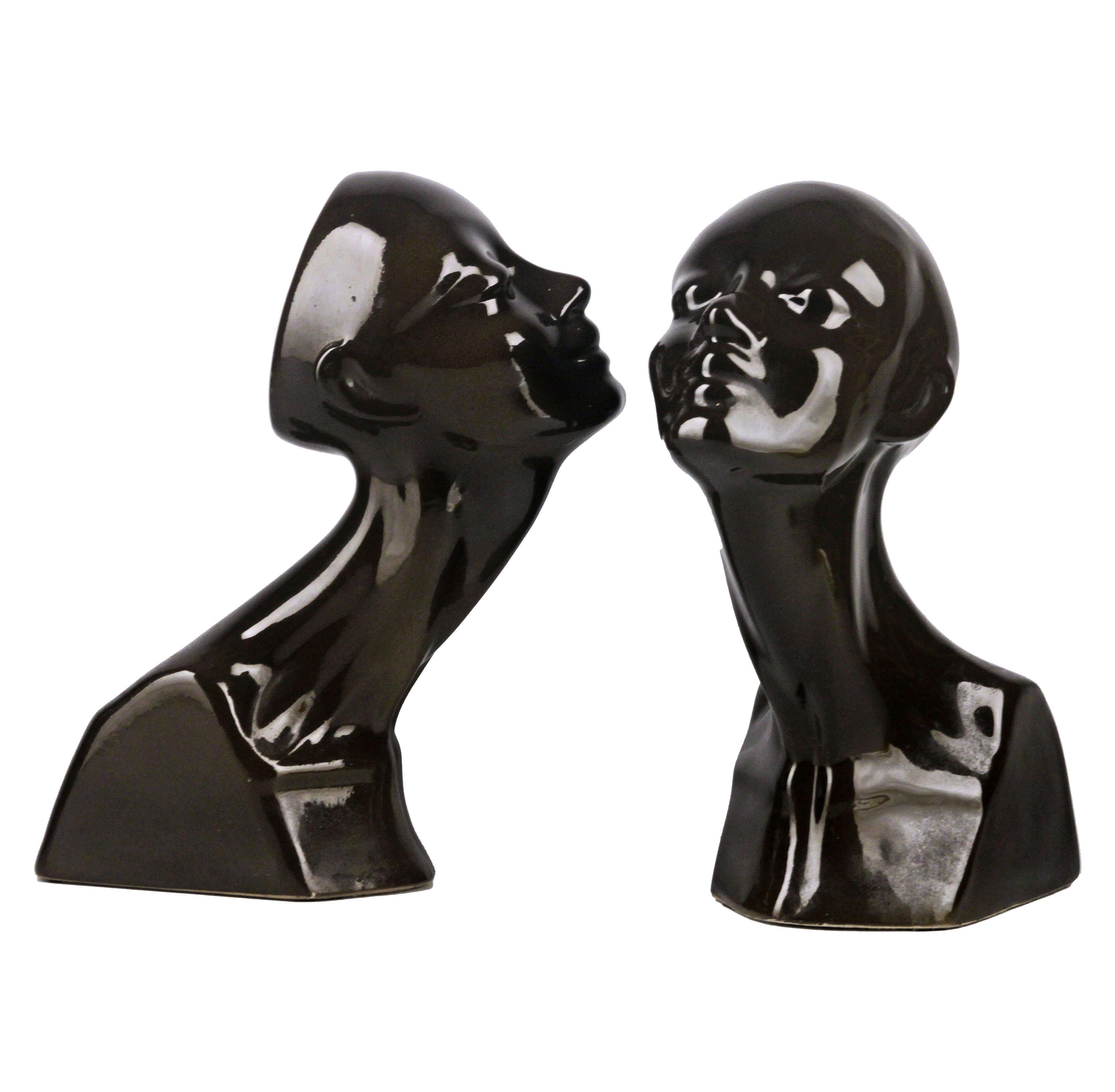 Pair of late 20th century french enameled glazed black ceramic women busts/heads

By: unknown
Material: ceramic, enamel, paint
Technique: pressed, molded, enameled, polished, painted
Dimensions: 9.5 in x 5.5 in x 13.5 in
Date: late 20th century,