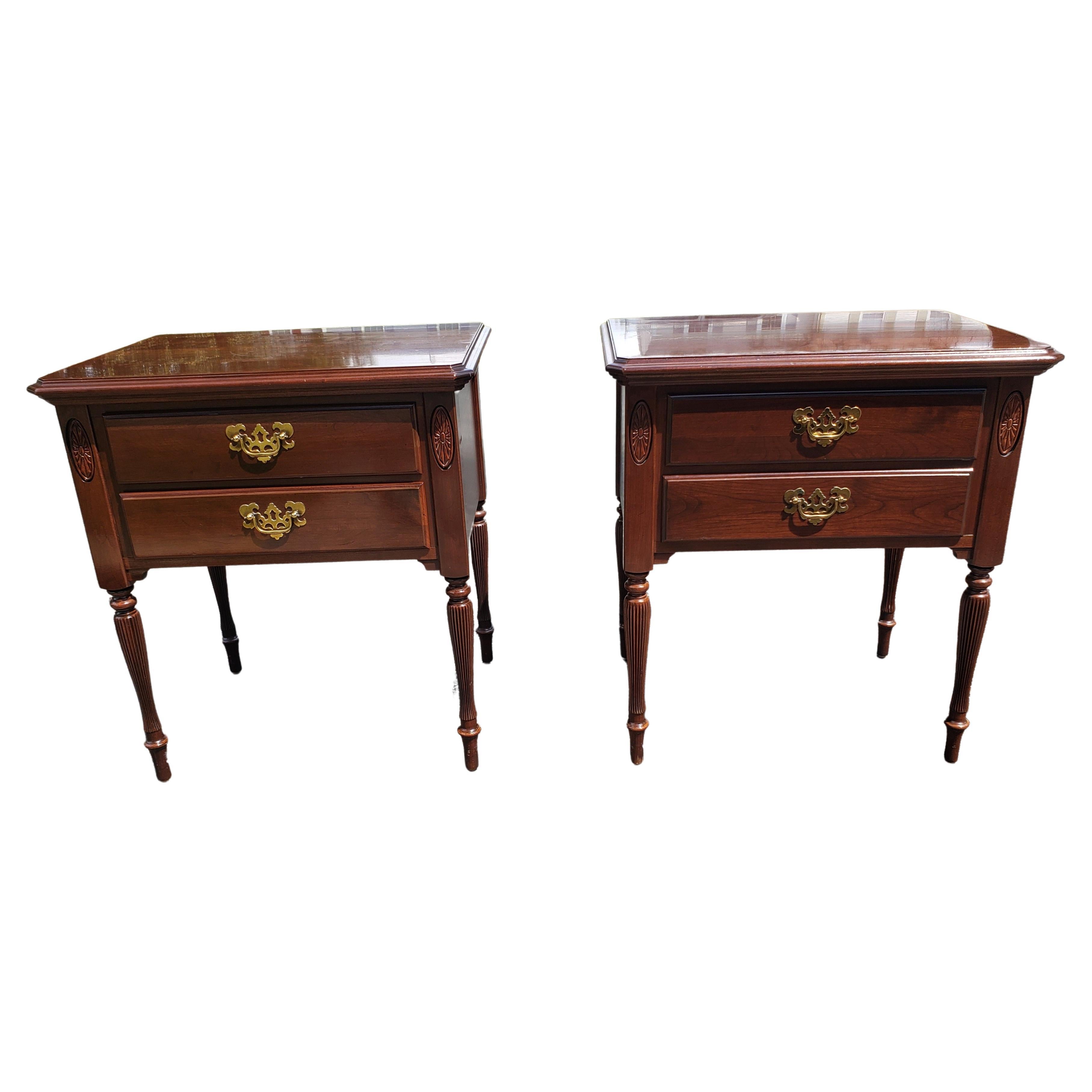 A gorgeous pair of 1990s Georgian style two drawers side tables or nightstands with fluted canellured legs and dovetail construction drawers. Measures 24