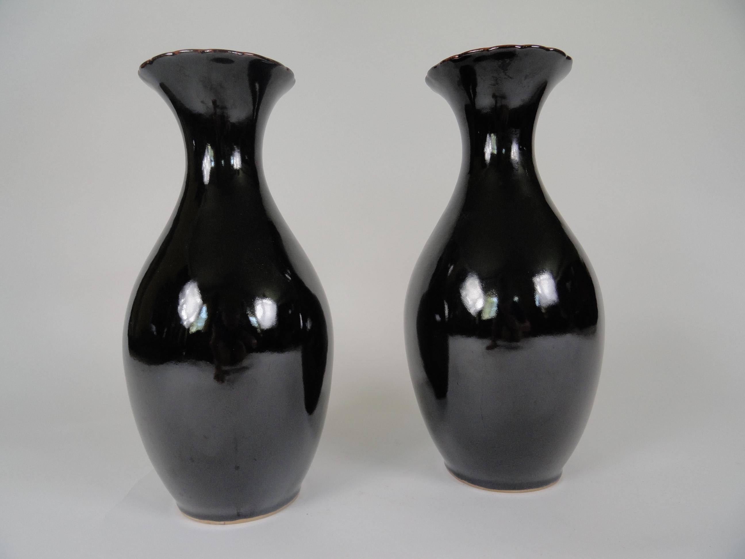 Pair of tete de negre ceramic vases, late 20th century with glazed finish.
Made in China.
One of the vases is slightly taller than the other (approximately .75 inches).