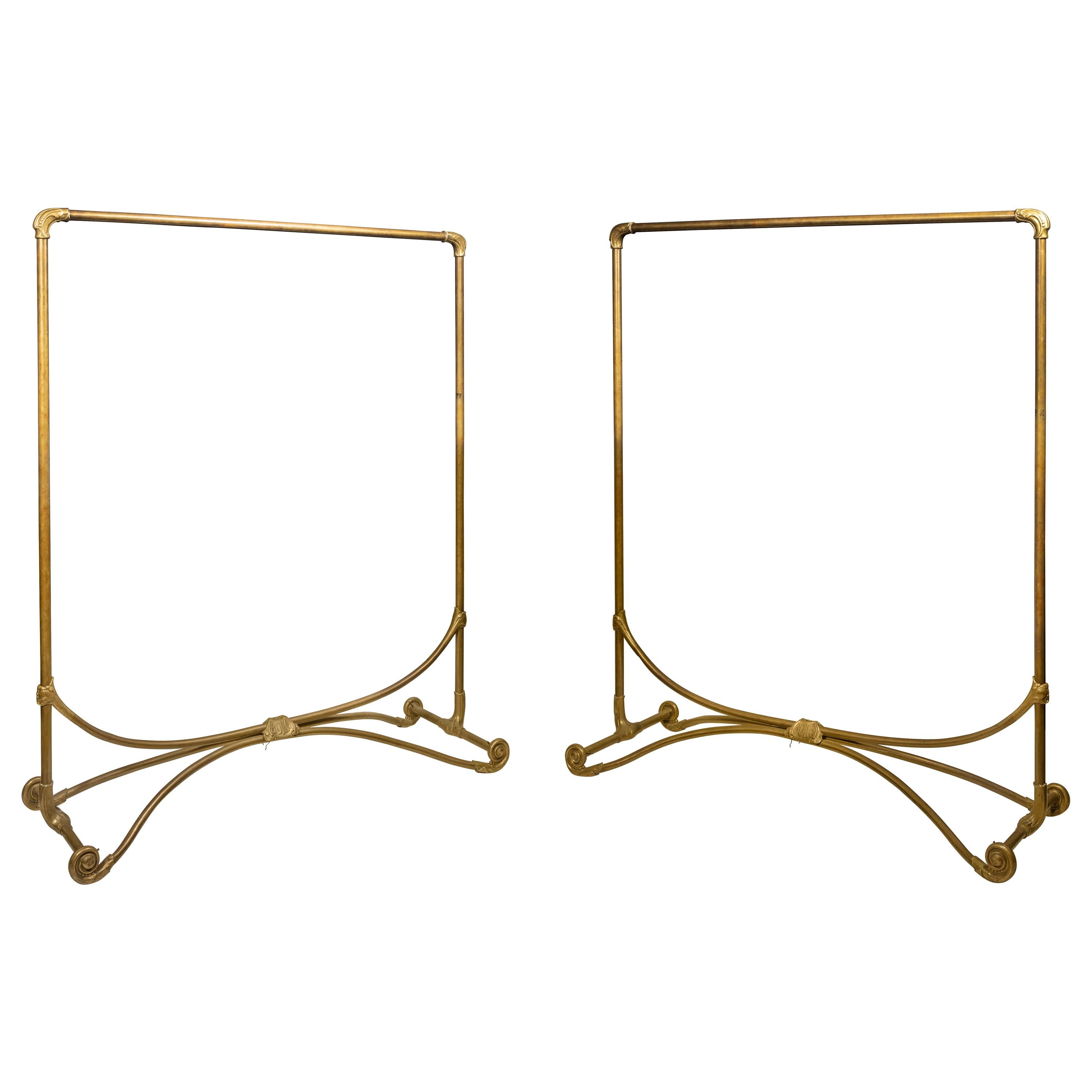 A Pair of Late Art Nouveau Brass Clothes Racks, circa 1920