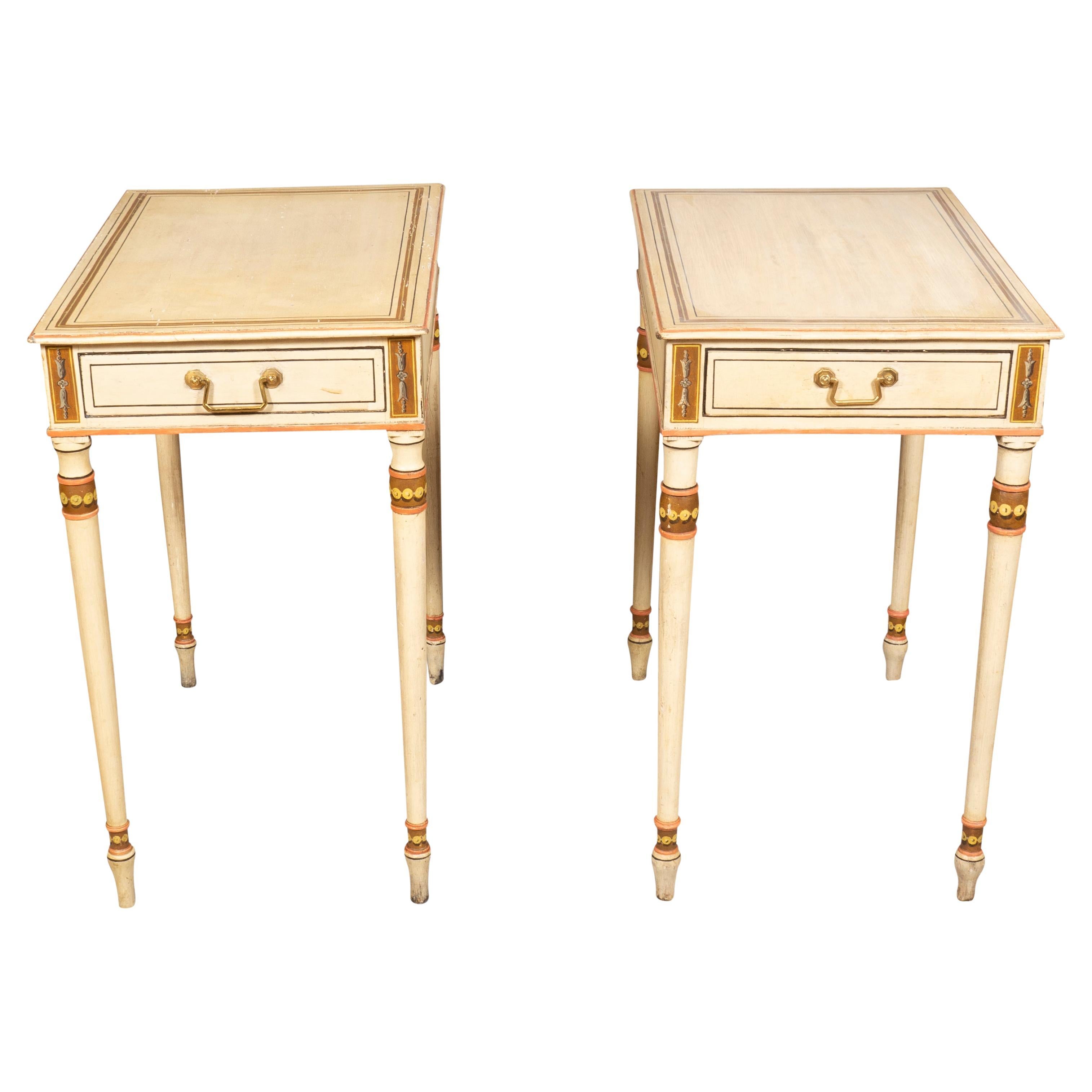 Each creme painted with ochre and grisaille detail. rectangular with a single drawer with square bail handle. Circular tapered legs and toupie feet.
