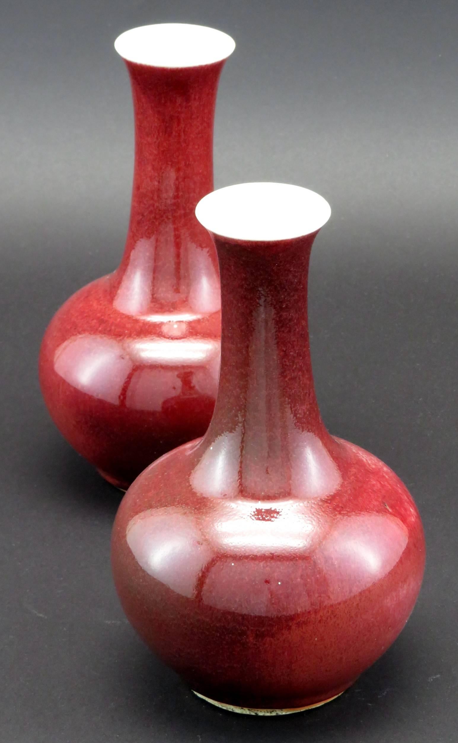 Chinese Pair of Late Qing Period Sang de Boeuf Porcelain Bottle Vases, China, circa 1900