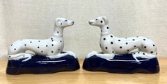 Pair of Late Staffordshire Recumbent Figures of Dalmatians