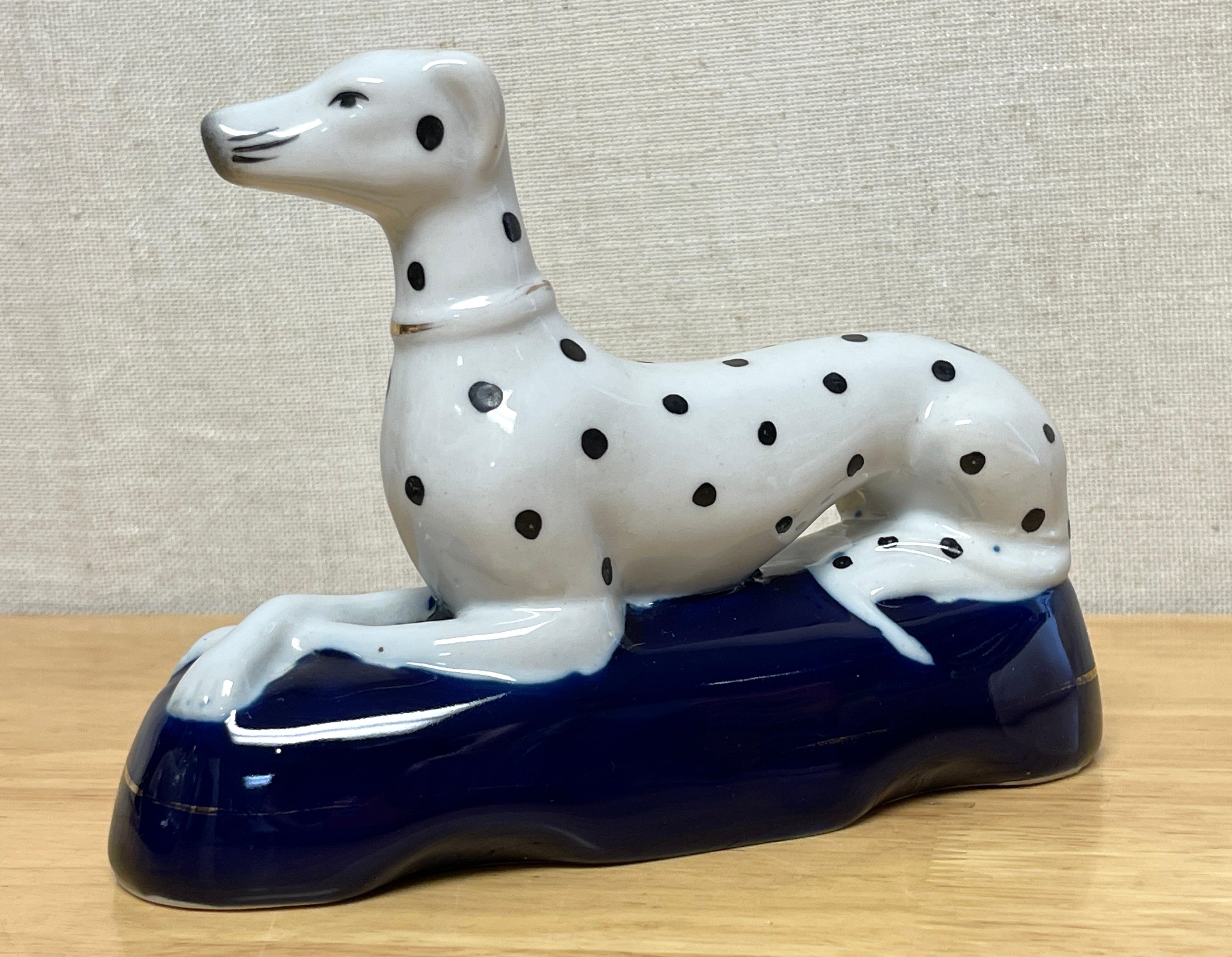 English Pair of Late Staffordshire Recumbent Figures of Dalmatians For Sale