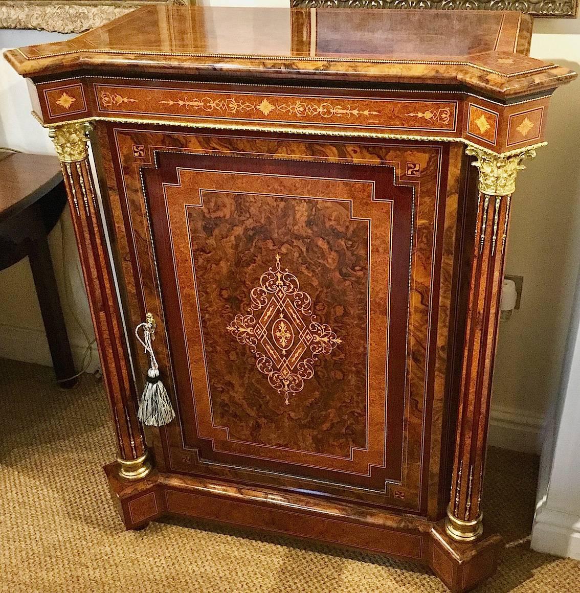 Made from various wood veneers on a mahogany carcass such as bird’s-eye maple, rosewood, fruit woods, etc.

Top: Burr walnut with Amboyna border and ebony stringing.
Door: Quarter cut burr walnut veneer with purple heart and Amboyna on a mahogany