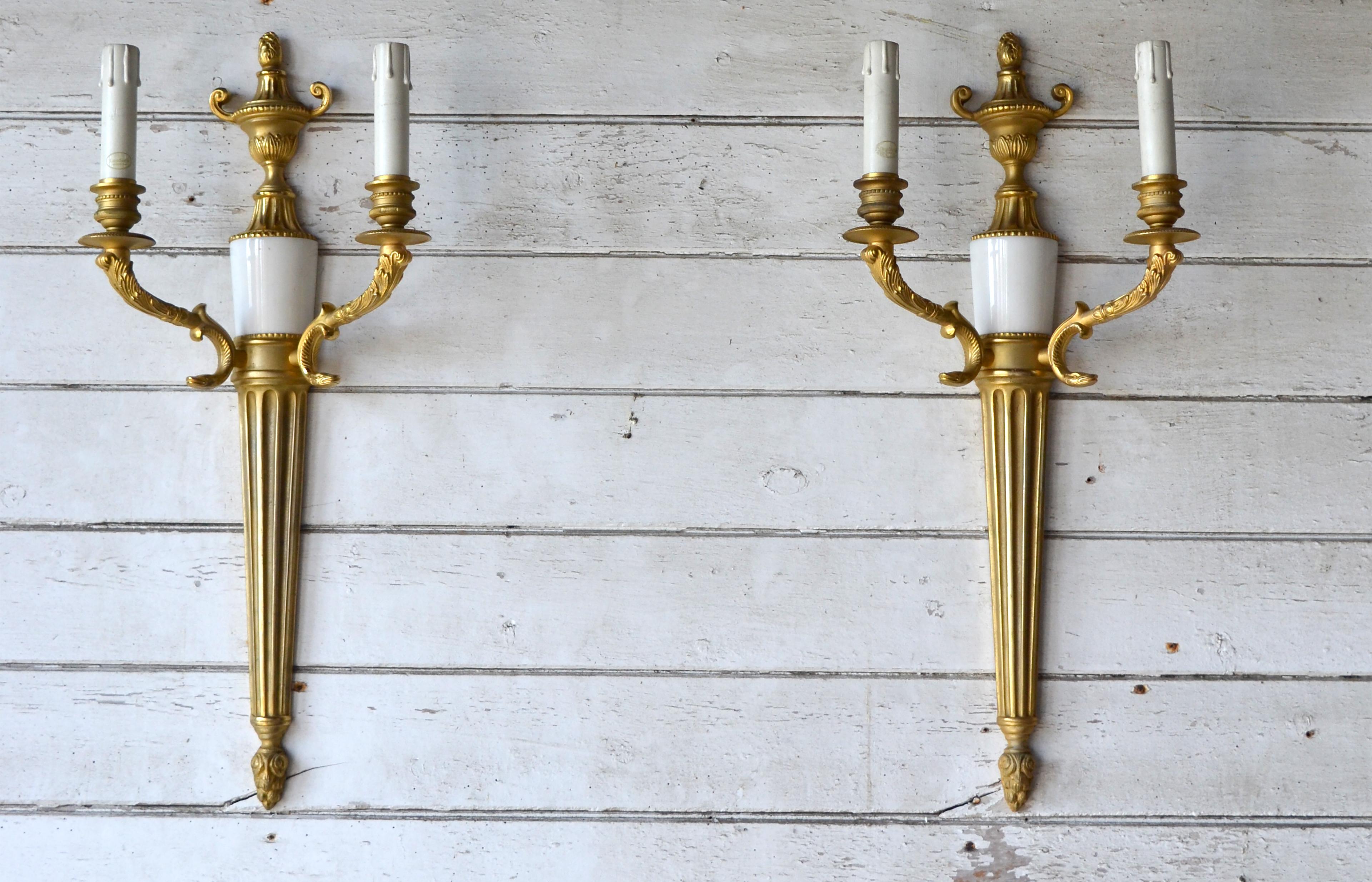 Tania is an Italian Classic wall sconce made with two lights, designed by Giovanni Maria Ma in the empire style, bronze with ancient gold 24k finish and marble inserts. A decedent wall light suitable for the most luxurious of spaces