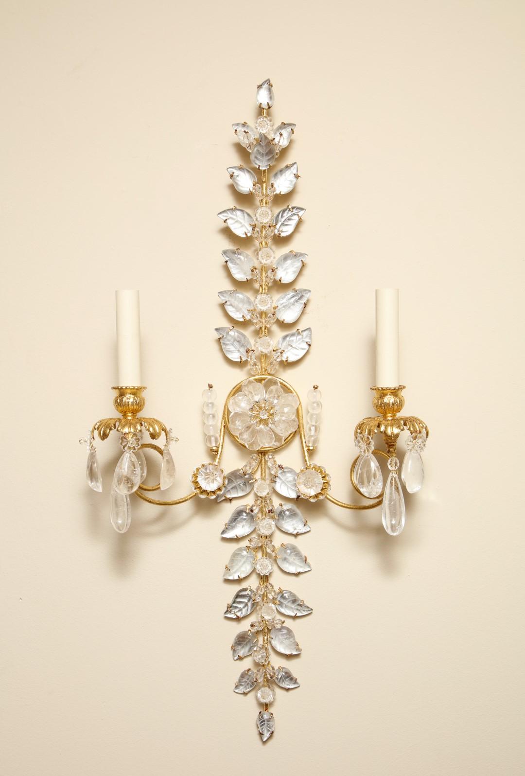 A pair of design rock crystal sconces in the form of laurel branches.