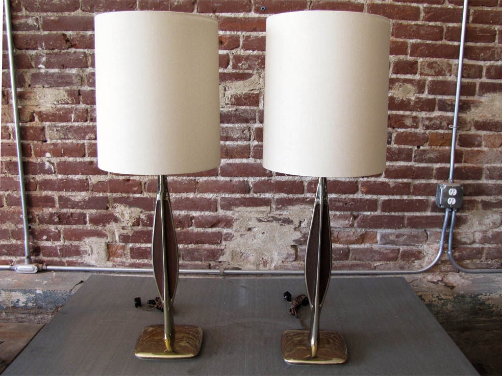 Gorgeous Laurel table lamps with slender brass bodies with walnut wood inlays on either side, linen drum shades.