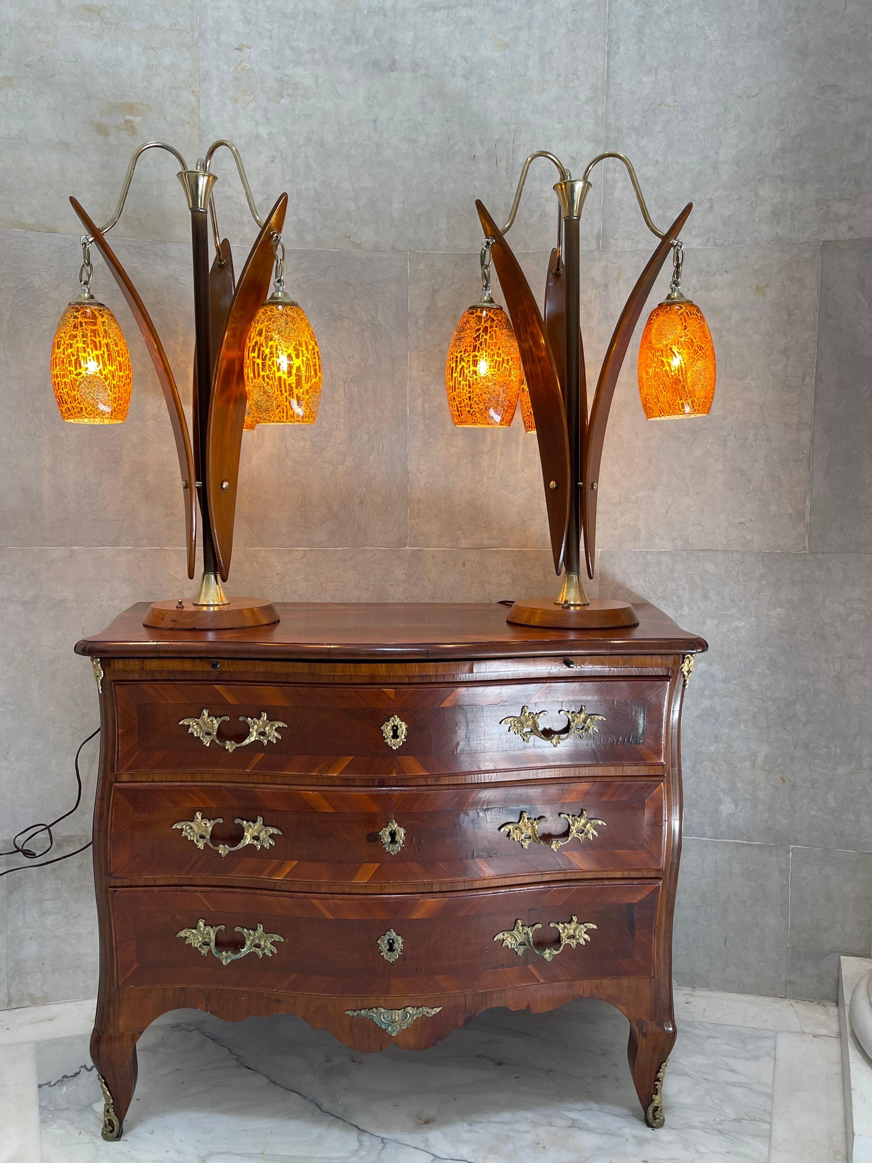 A rare pair large pair of Danish style MCM Lamps. 
They are three sided and set themselves up to go either against the wall or in the middle of a room. 
Out of the circular solid walnut base rises a brass central rod, off which three brass arms bow