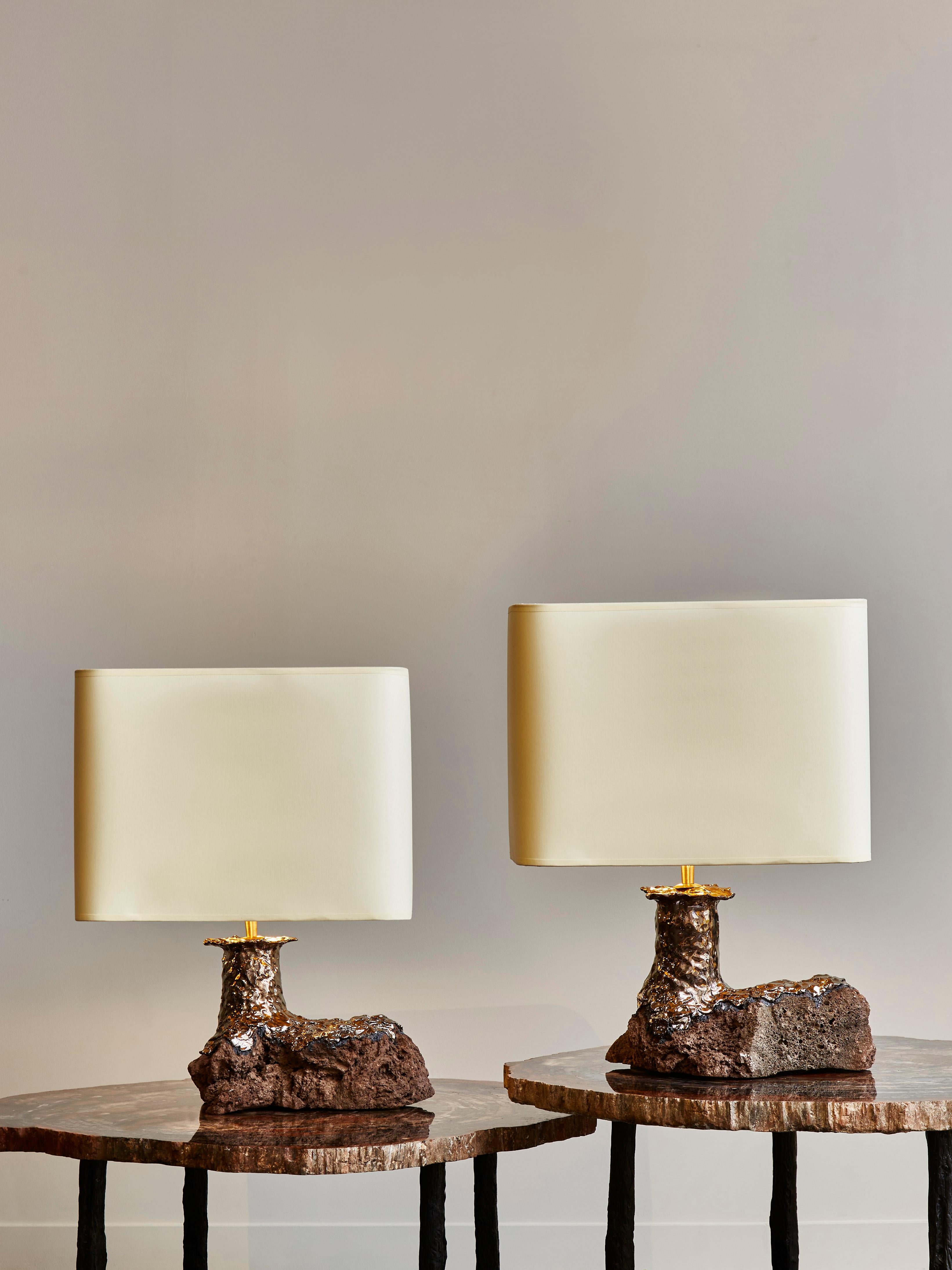 Pair of table lamps by the artist Leo Nataf, made of carved lava stone covered with glazed ceramic.
