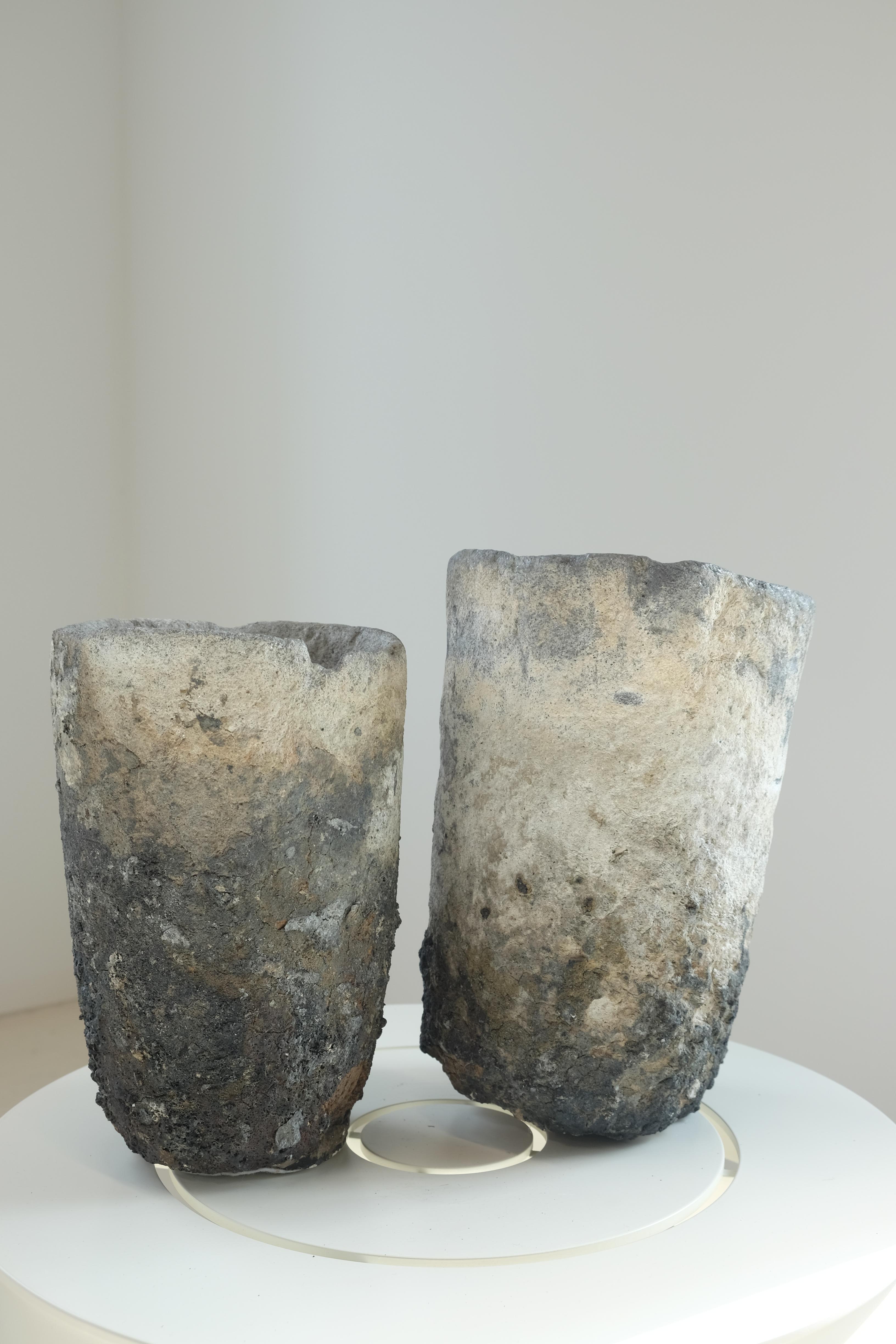 Pair of Lavastone foundry crucibles from France, circa 1900. Measurements: Taller crucible 13