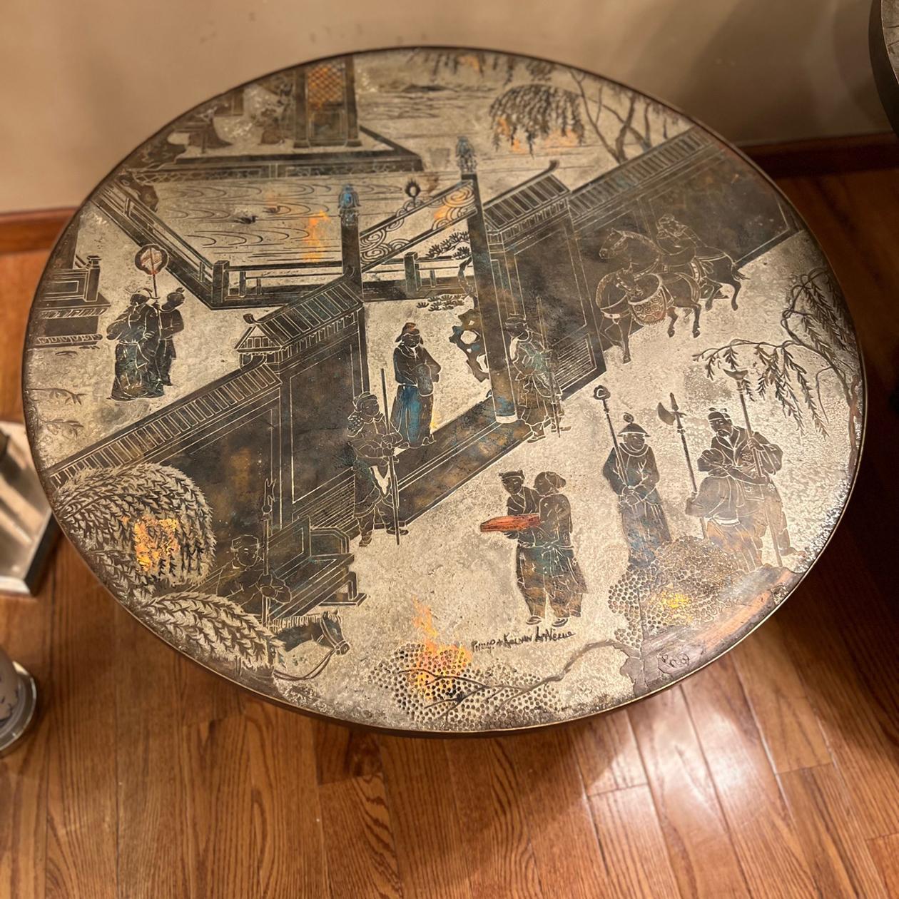 A circa 1960's American acid-etched and patinated bronze LaVerne coffee table with chinoiserie motifs, original patina and an octagonal base. 

Measurements: 
Diameter: 35.25
