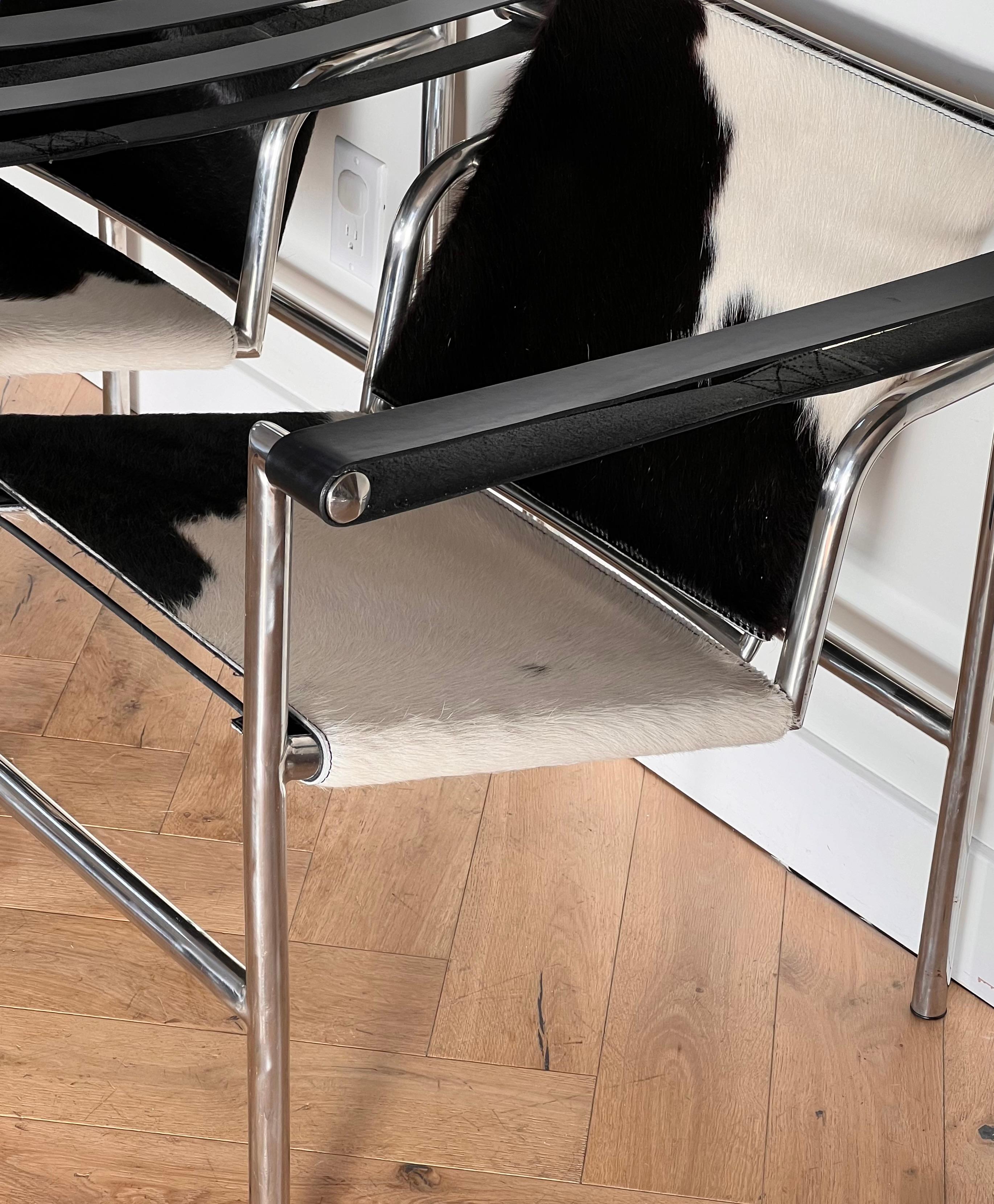 Pair of Lc1 cowhide chrome chairs by Le Corbusier, Perriand, Jeanneret, 20th c. In Good Condition In View Park, CA