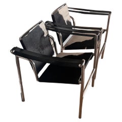 Pair of Lc1 cowhide chrome chairs by Le Corbusier, Perriand, Jeanneret, 20th c.