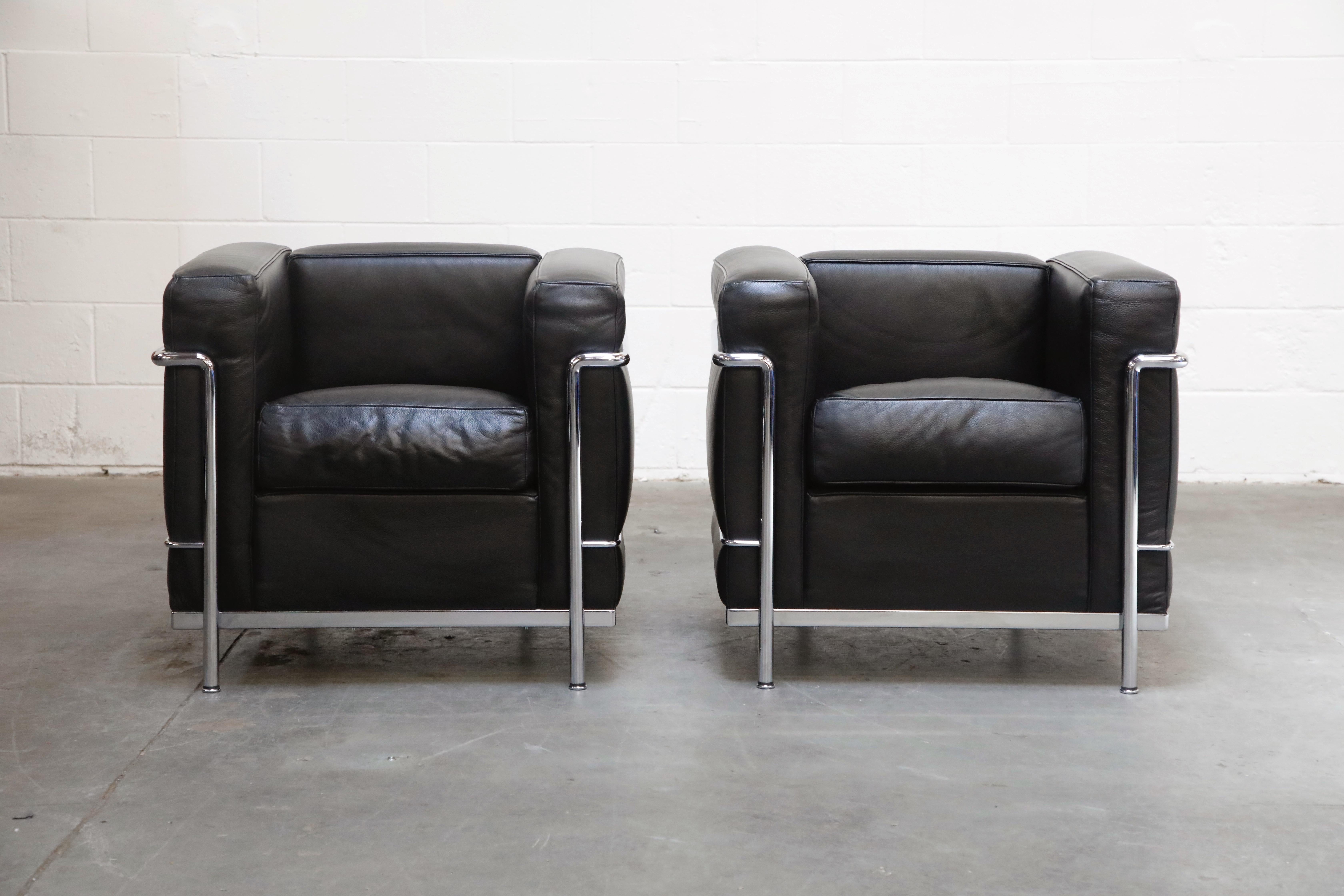 This incredibly comfortable pair of Le Corbusier for Cassina (authentic signed) LC2 Club Chairs in gorgeous thick Italian black leather, priced in this listing as a pair (two chairs). We also have the matching three-seat sofa that came from this set