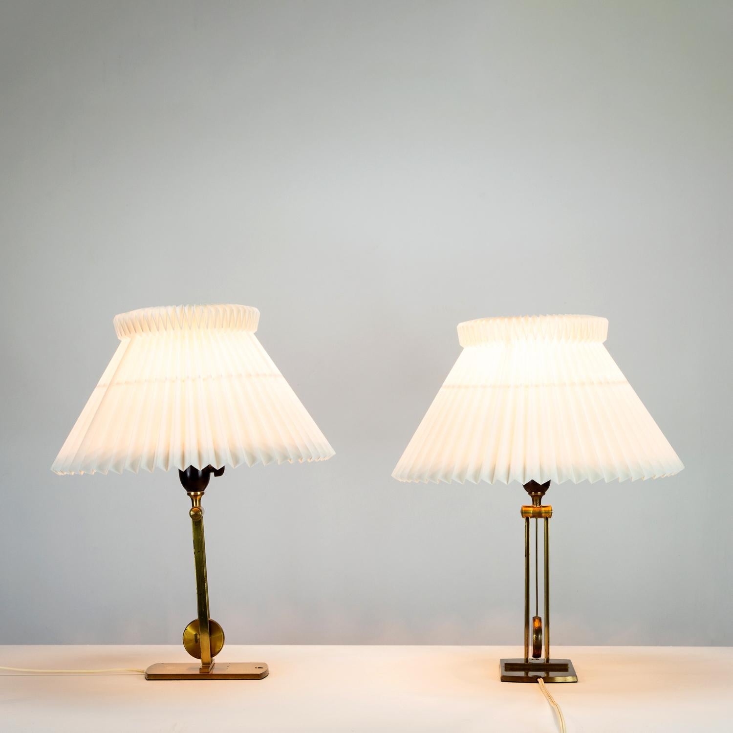 A pair of Le Klint Model 430 wall or table versatile lights in brass and original Le Klint folded shades. Patinated brass and some minor creases on the shades. Denmark, 1960s.

 