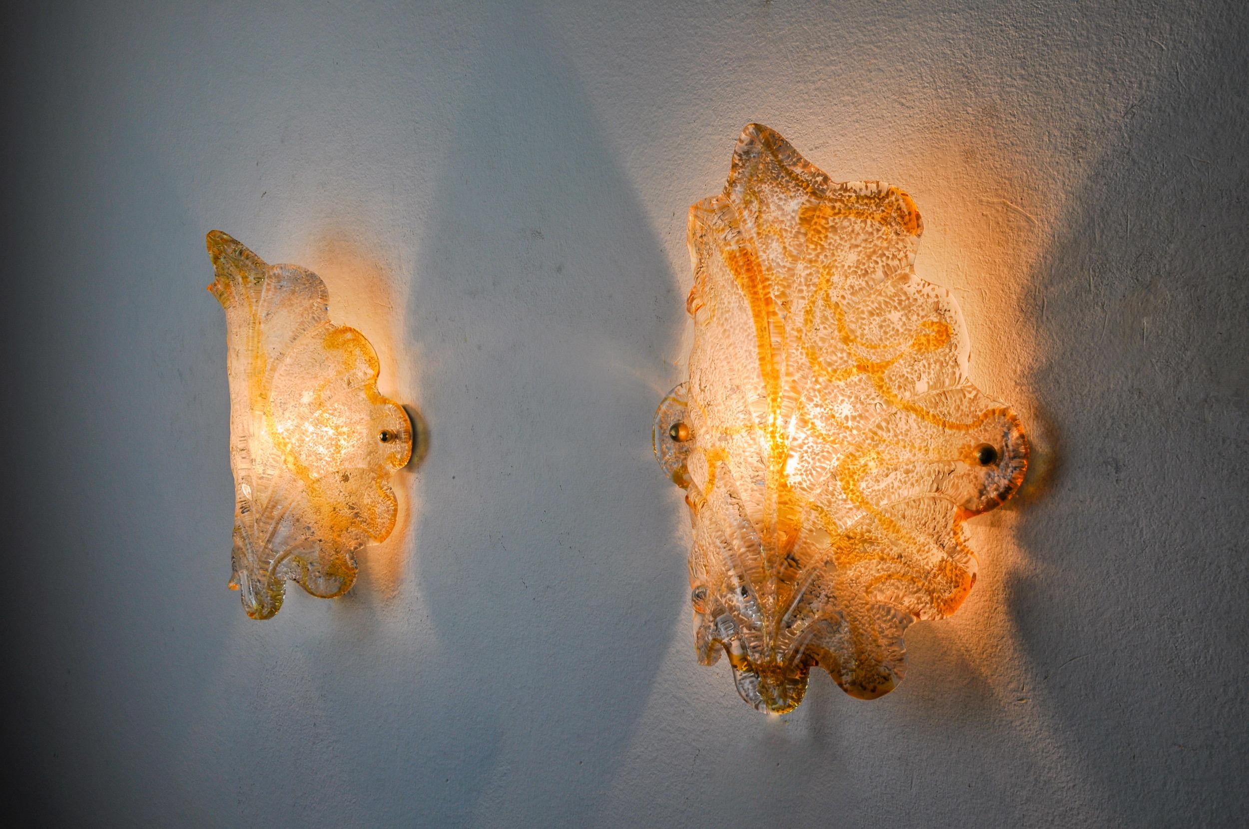 Very beautiful pair of floral sconces mazzega designated and produced in italy in the 70s. This pair of sconces is composed of a sheet of white and orange frosted murano glass supported by a white metal structure. Rare design object that will