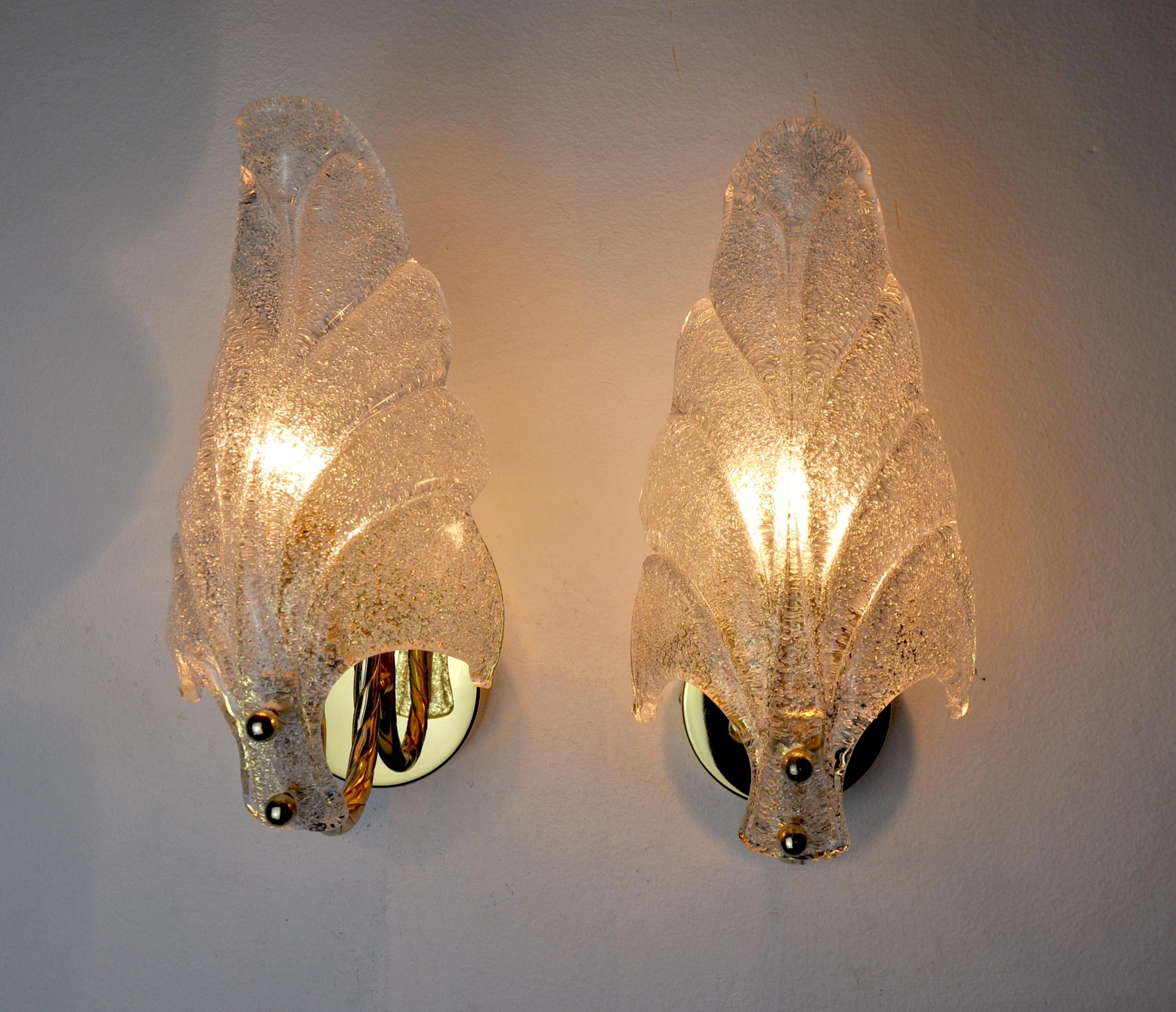 Superb pair of carl fagerlund wall lamps for lyfa dating from the 70s.

Structure in gilded metal and frosted glass in the shape of a sheet.

The diffused light is soft and harmonious perfect to illuminate your interior.

Time mark consistent