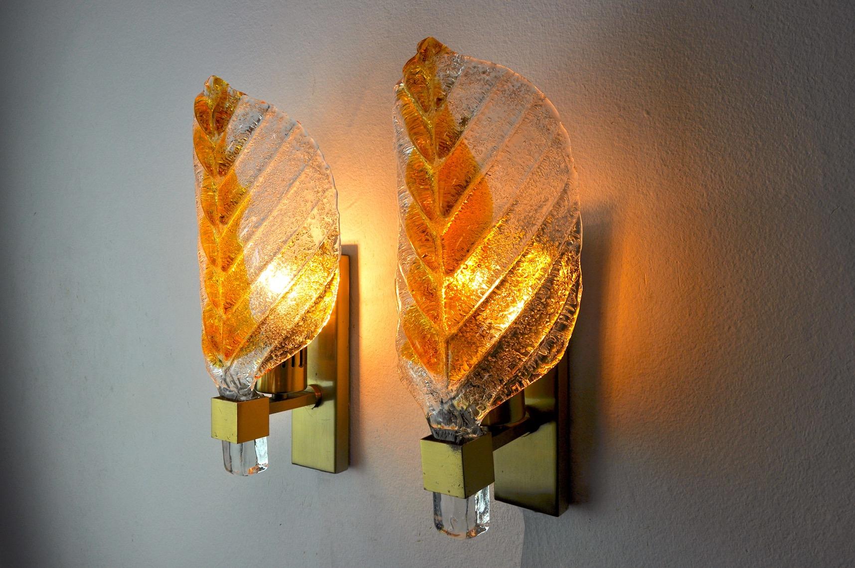 Very nice pair of carl fagerlund sconces for lyfa dating from the 70s.

The appliques are composed of a gilded metal structure and a frosted murano glass in the shape of an orange leaf.

The diffused light is soft and harmonious perfect to
