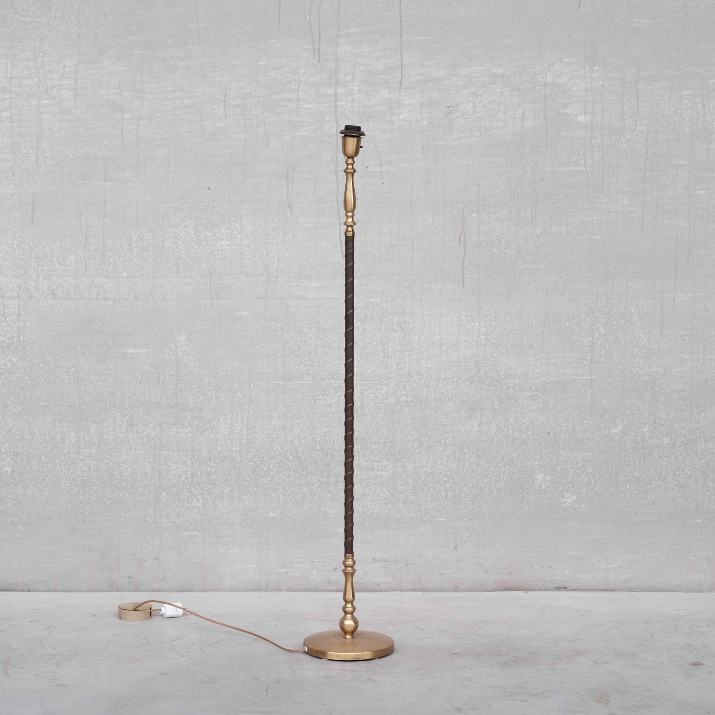 A pair of leather and brass floor lamps by Einar Bäckström. 

Sweden, c1950s. 

Good vintage condition, some natural aging to the the brass. 

Since re-wired and PAT tested.

PRICE IS FOR THE PAIR.

Location: Belgium Gallery.