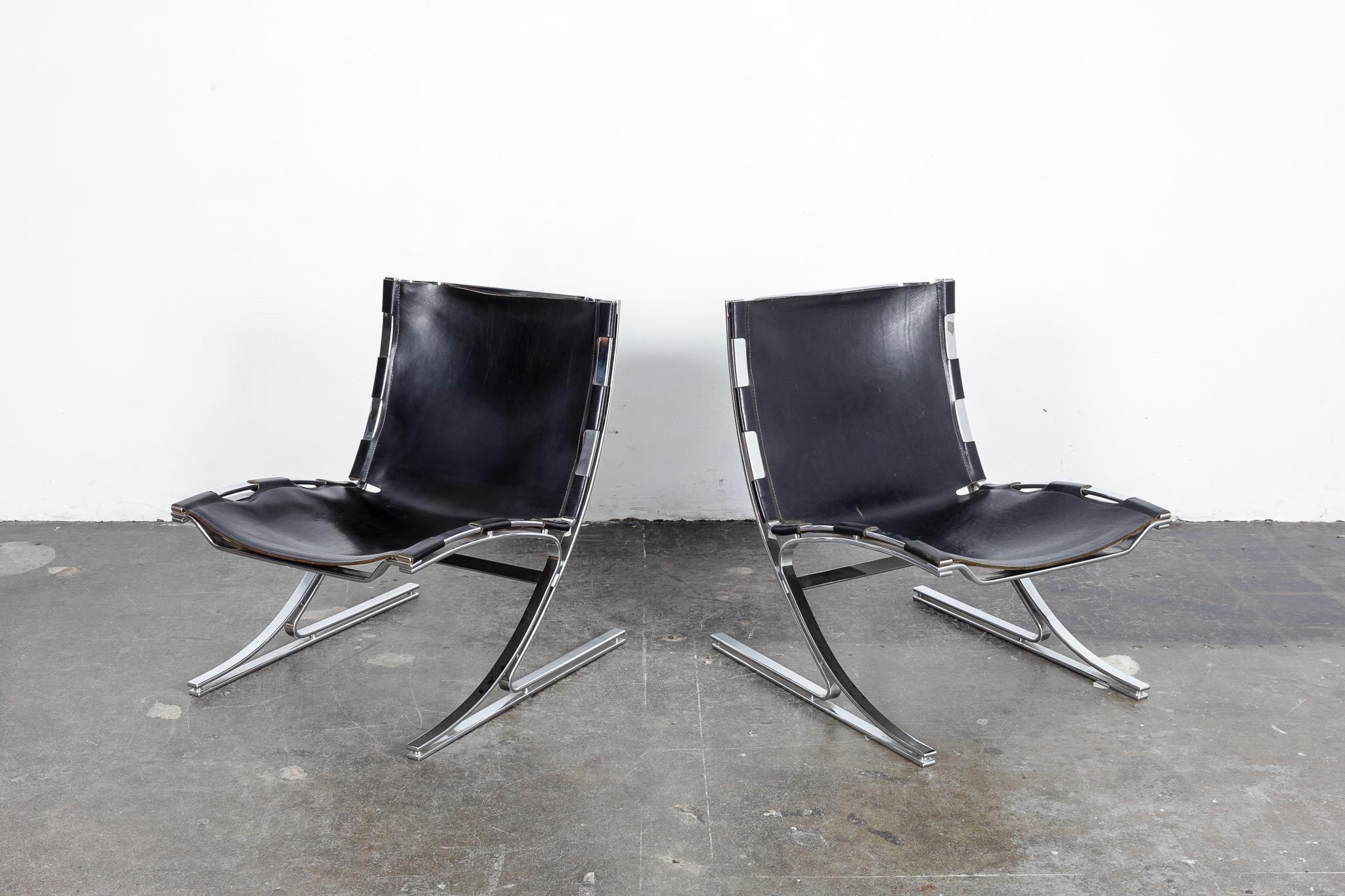 Pair of very rare flat bar metal and original black leather sling chairs designed by Meinhard Von Gerkan, German Architect, in 1972 for the VIP lounge in the Berlin Airport. A total of 48 of these were produced by Walter Knoll. These are from the