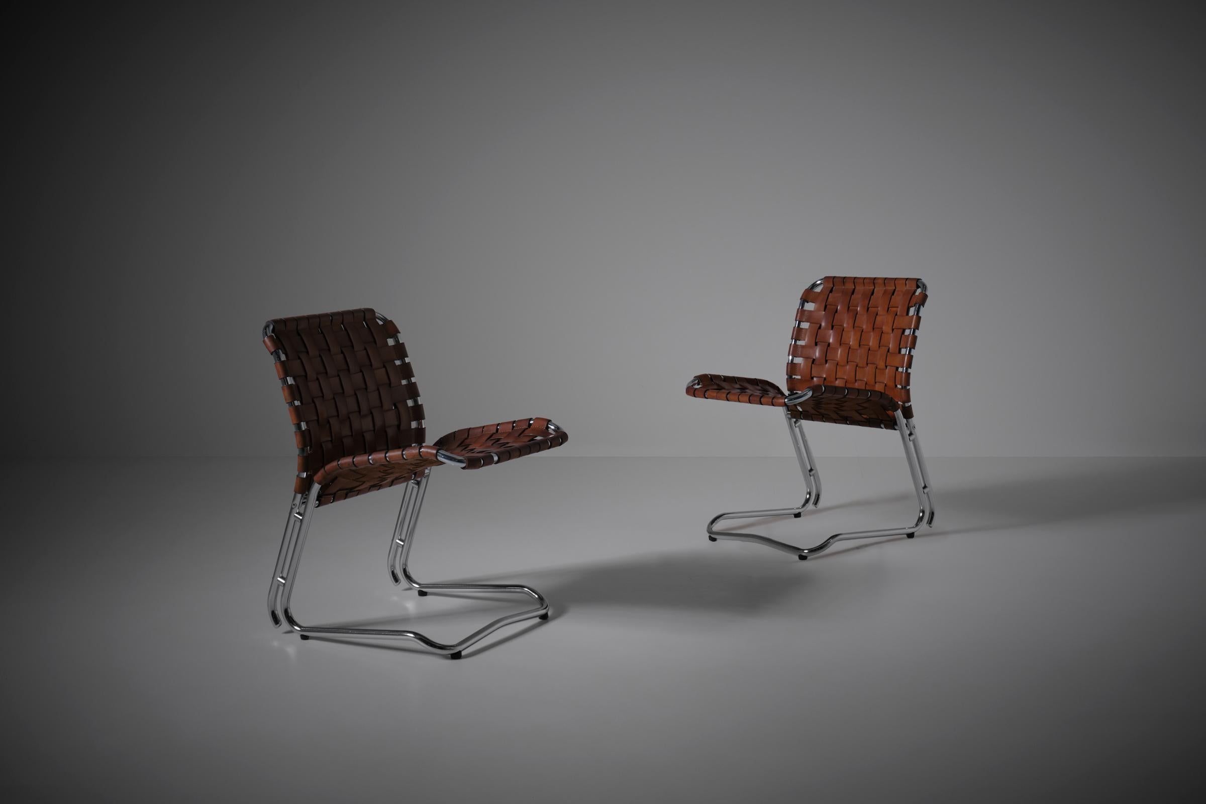 Pair of Italian side chairs, 1960s. Remarkable design and combination of materials. The high quality chromed tubular frames make a stunning contrast with the warm colored saddle leather straps; the original leather remains in a very good strong and