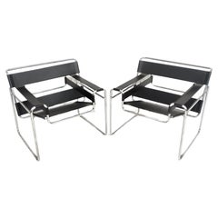 Pair of leather and metal Wassily armchairs by M. Breuer for Gavina  60's, 70's