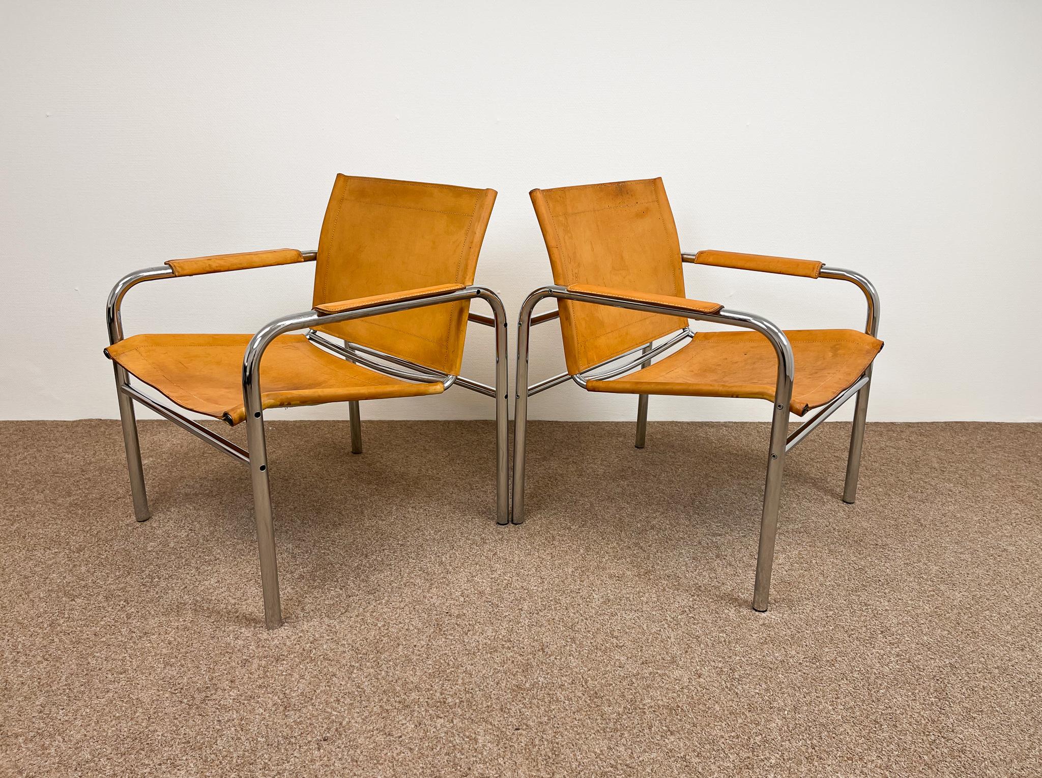 These two beautiful pair of armchairs, model Klinte, was designed by Tord Bjorklund, Sweden and produced for Ikea in the early 1980s. Today they are a vintage icon. The chairs having a tubular chromed steel frame with natural brown-taupe leather