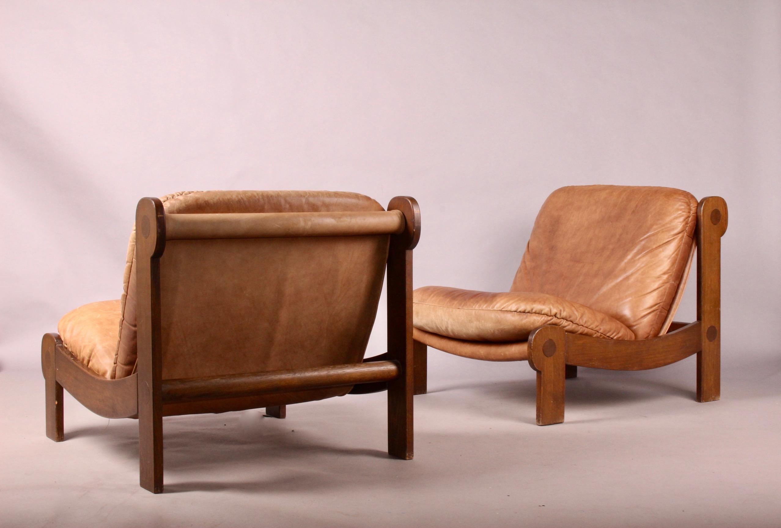 Pair of leather and wood armchairs, nice patina.