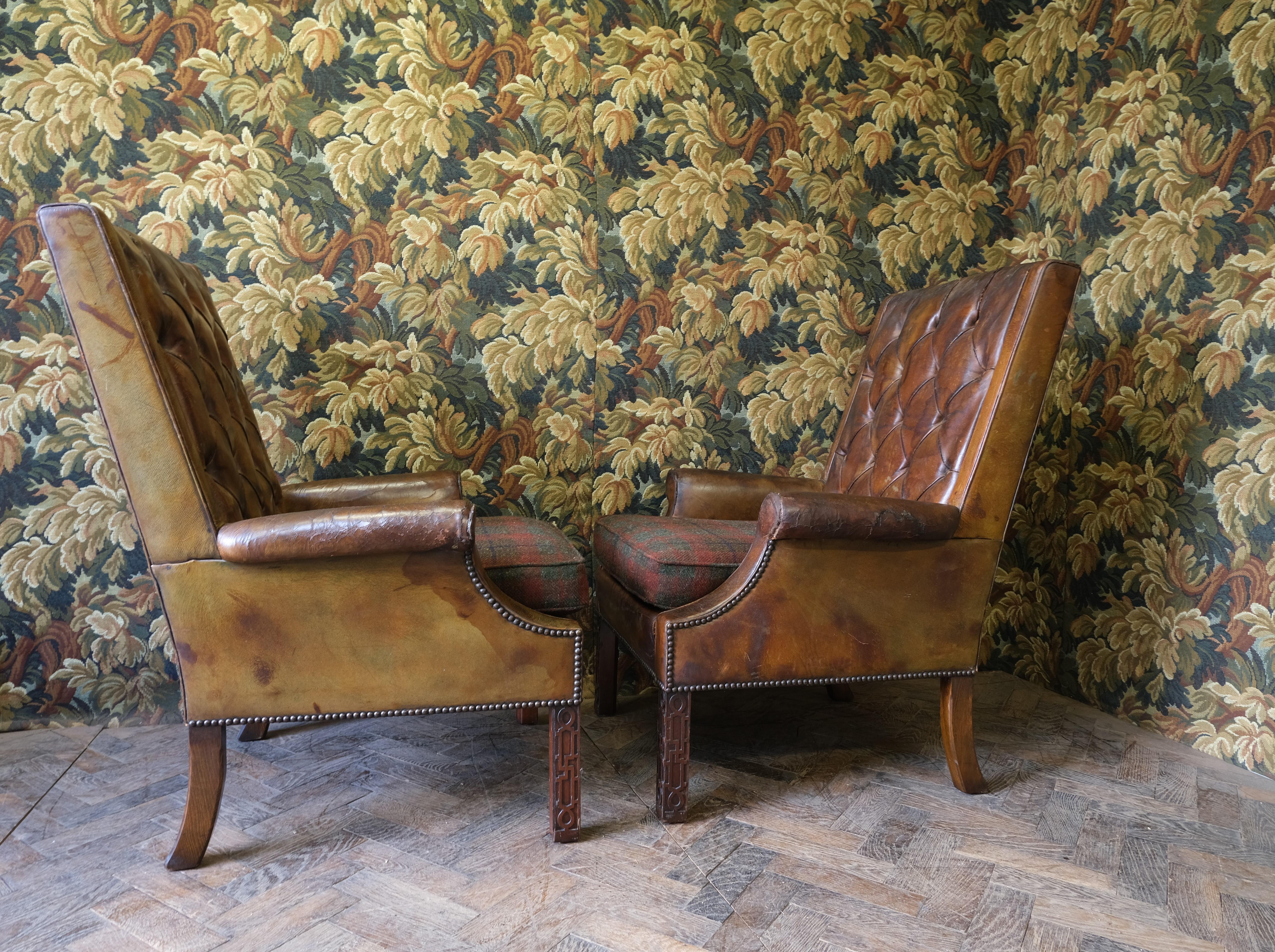 Hutton-Clarke Antiques is delighted to showcase an exquisite pair of early 20th-century English armchairs, a testament to timeless elegance and craftsmanship. These armchairs are masterfully upholstered in original, shabby chic leather,