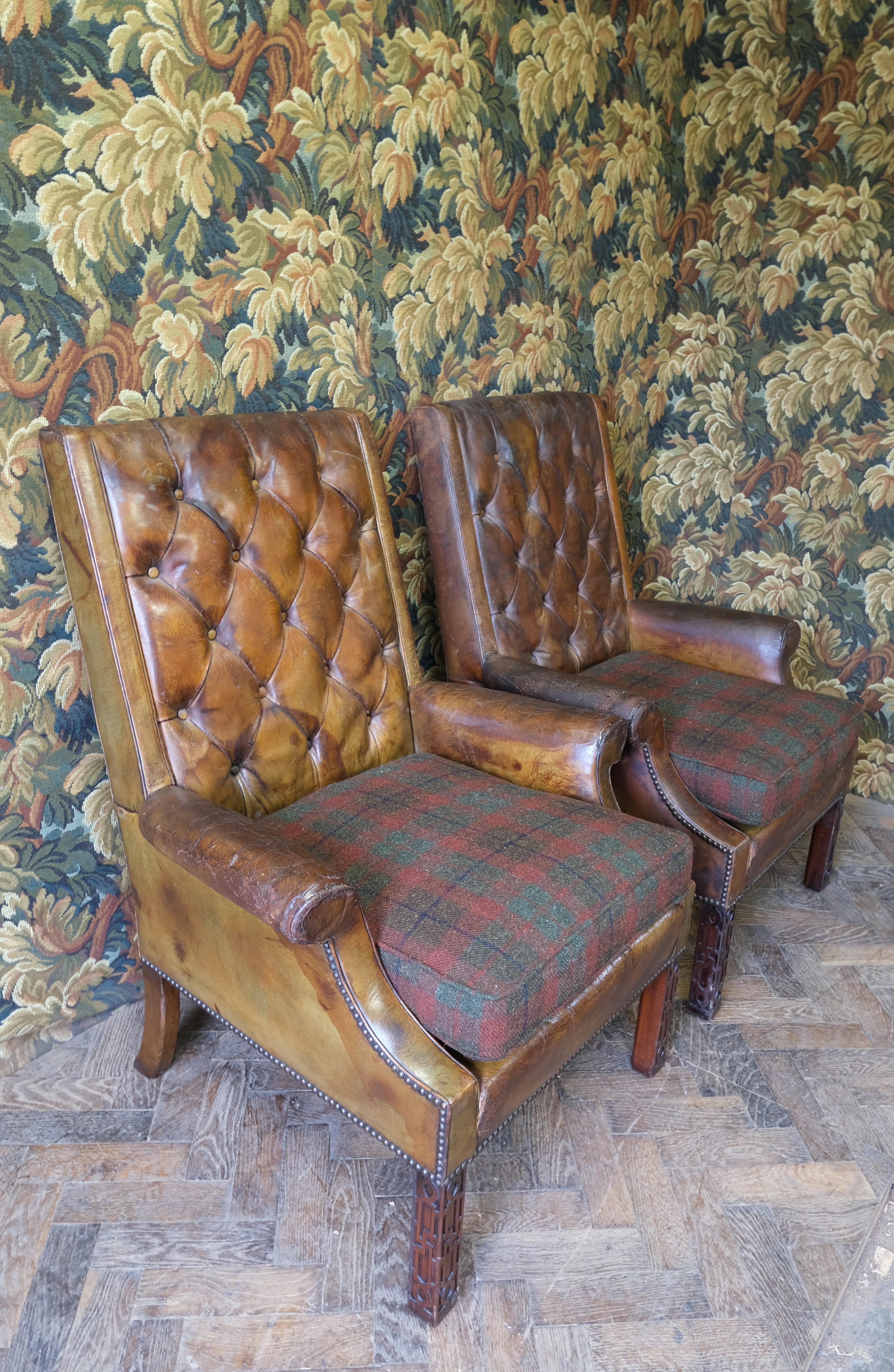 Carved Pair of leather and wool upholstered armchairs For Sale