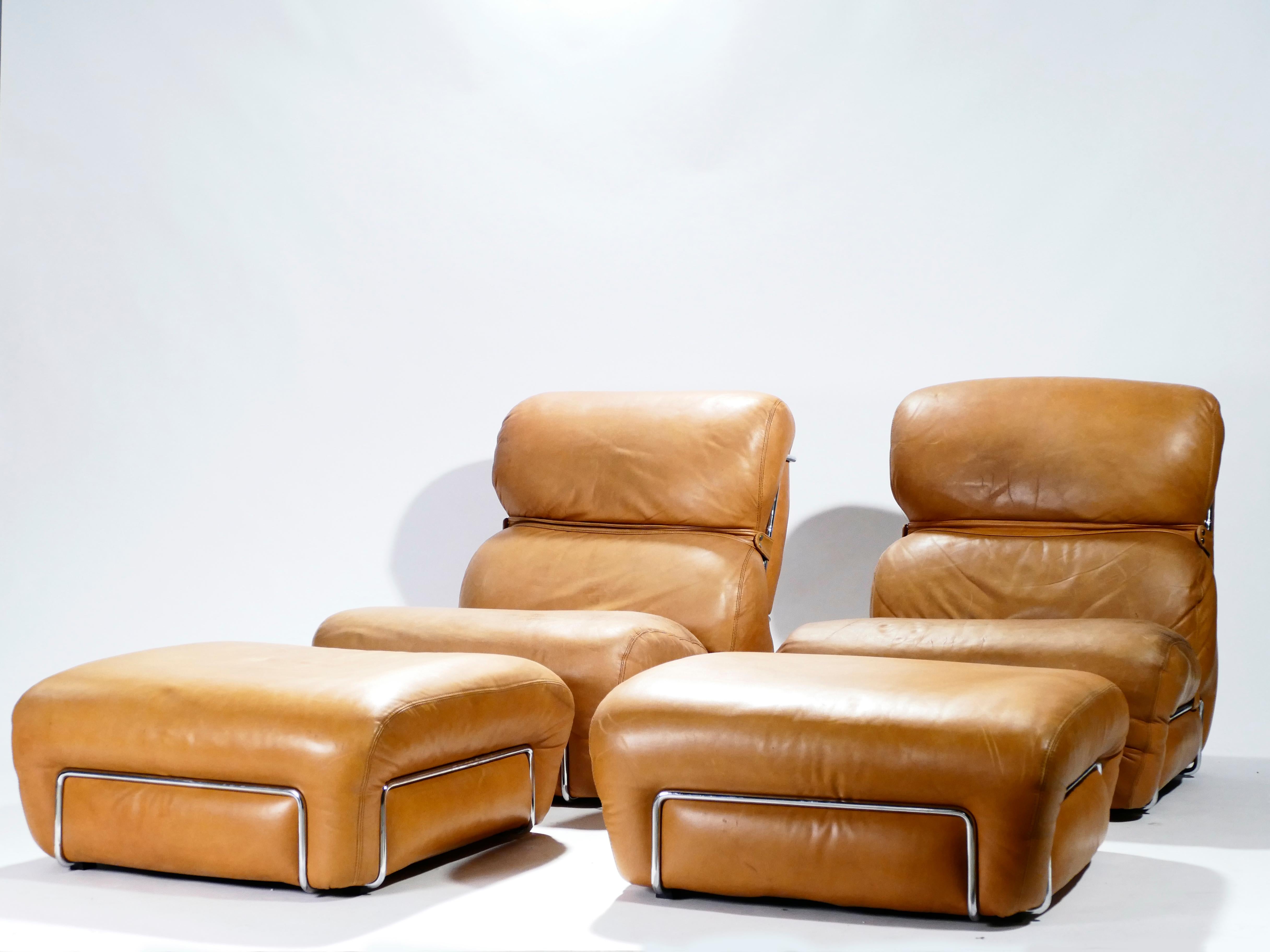 Beautiful patina shows the vintage status of this pair of Italian leather armchairs with matching leather ottomans designed by Gianfranco Frattini during the 1970s. A chrome structure holds the cushions, its shine contrasting brightly against the