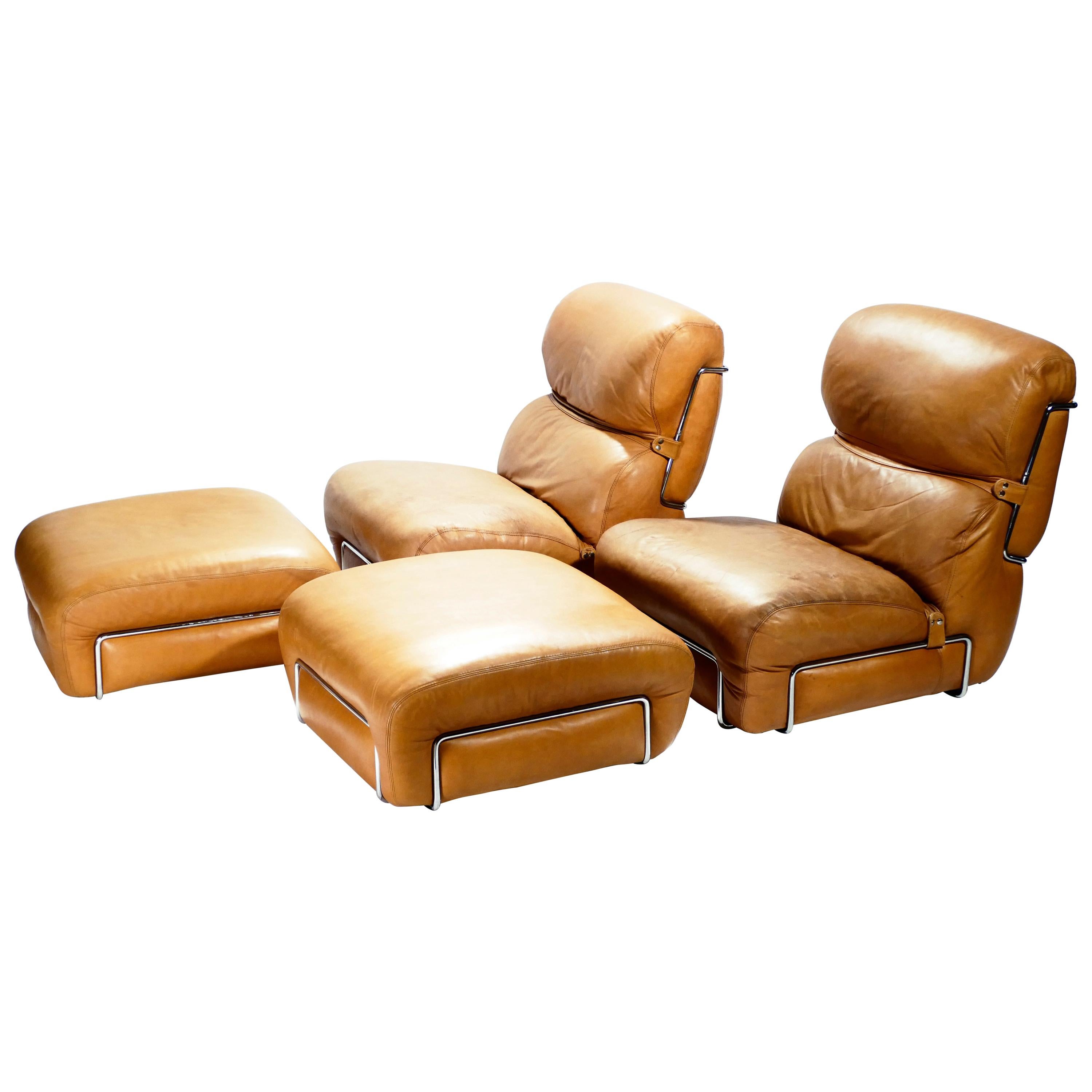 Beautiful patina shows the vintage status of this pair of Italian leather armchairs with matching leather ottomans designed by Gianfranco Frattini during the 1970s. A chrome structure holds the cushions, its shine contrasting brightly against the
