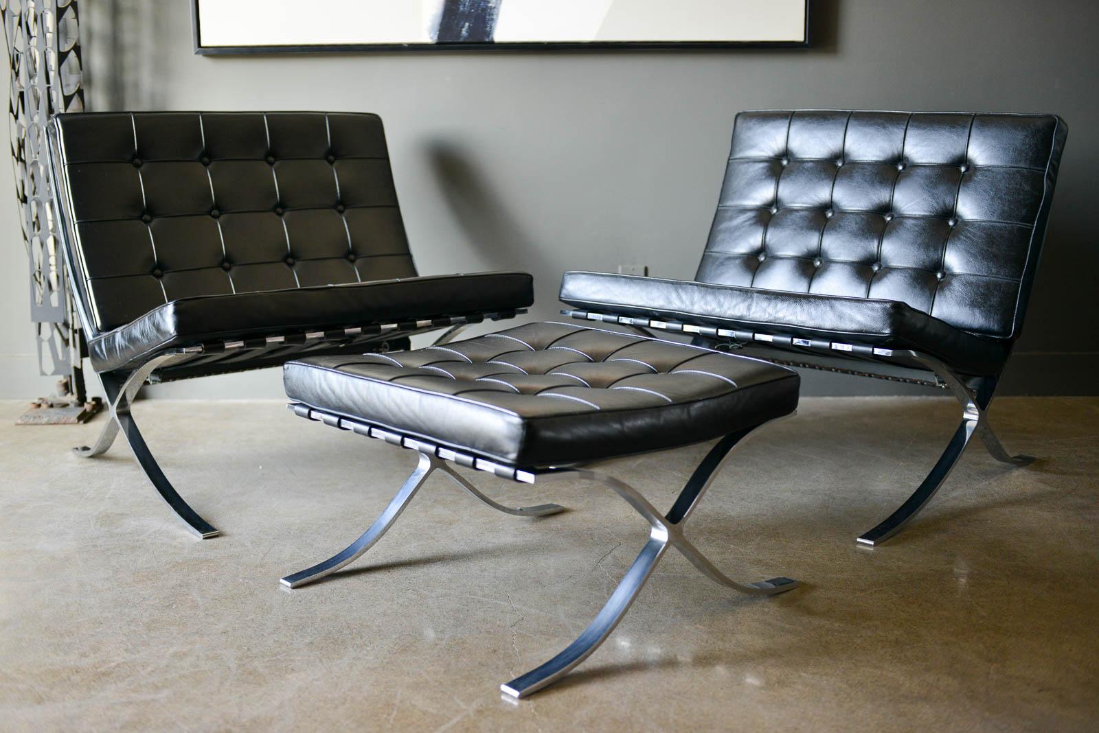 Pair of Barcelona chairs with ottoman. Original black leather cushions with very slight wear as shown otherwise excellent. Polished chrome frames. 

Chairs measure H 30.25